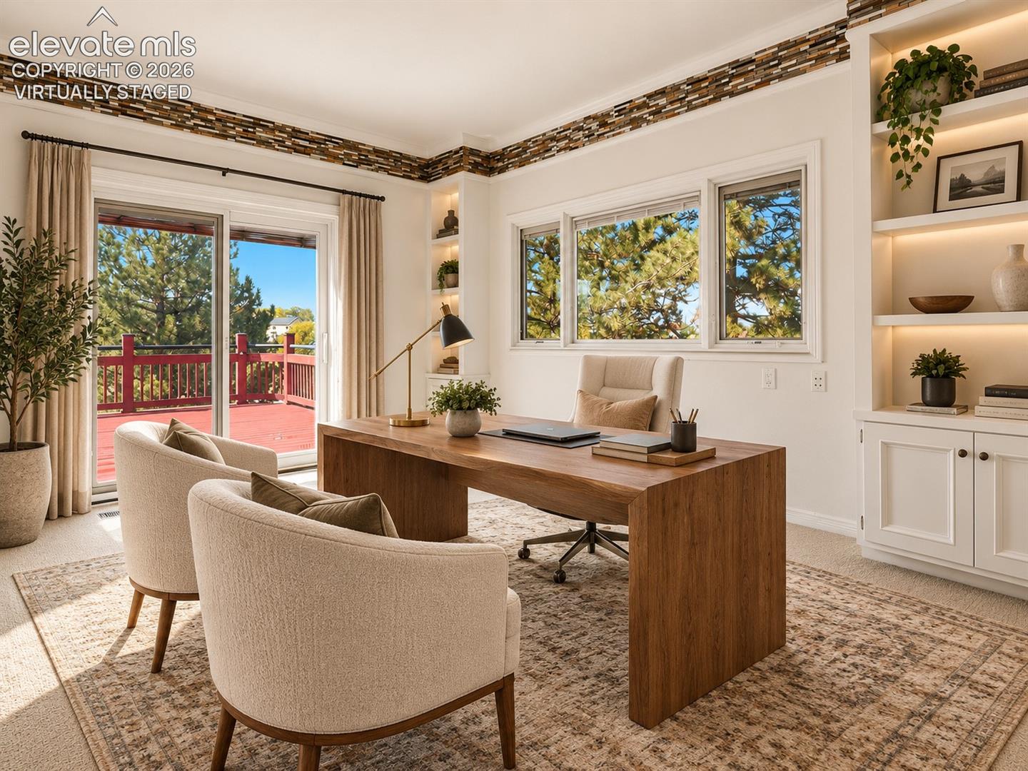 Built-in cabinetry featuring illuminated shelving and lower storage, decorative stone-finish crown molding, and sliding glass doors with exterior deck access- virtually staged