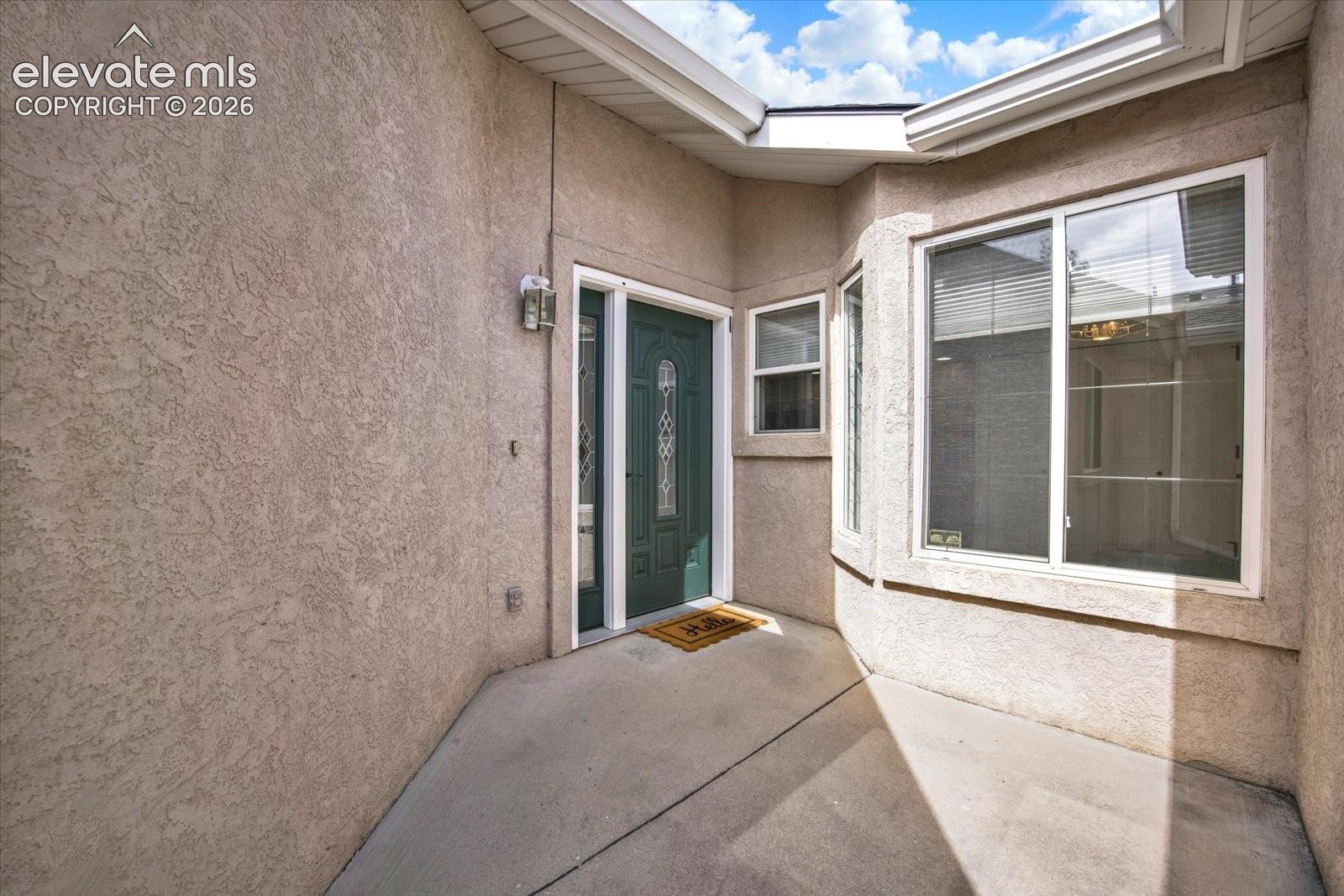 Gated courtyard entry.