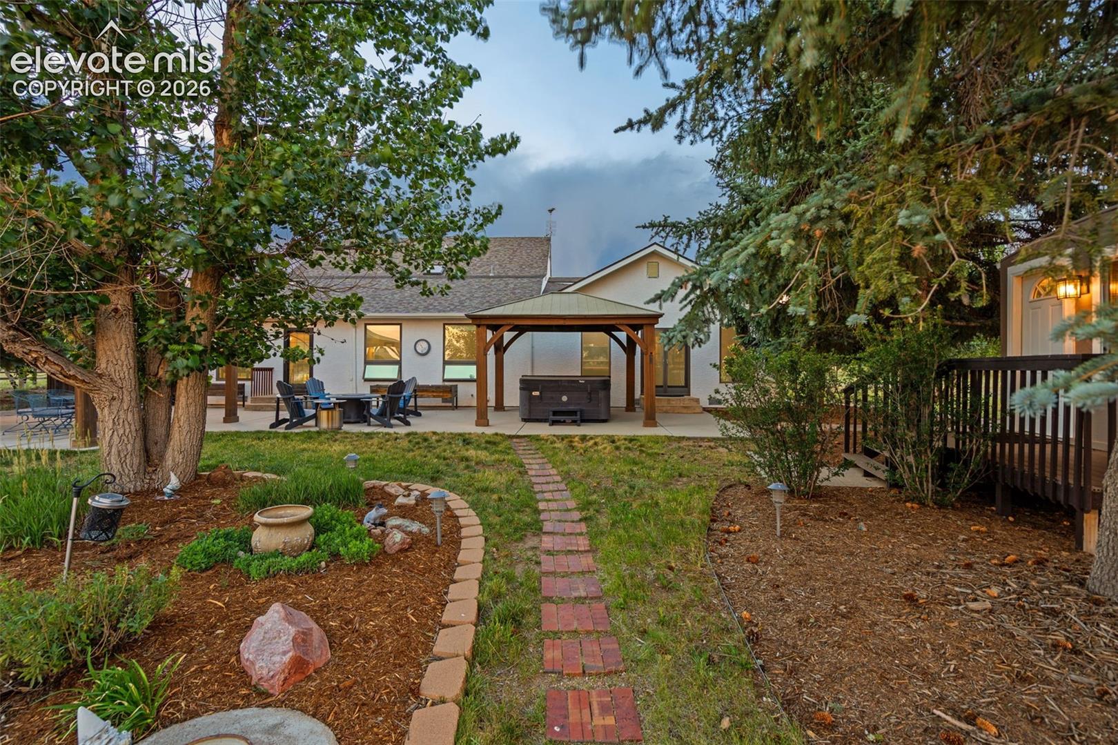 Pathway from house leading to barn and tool shed