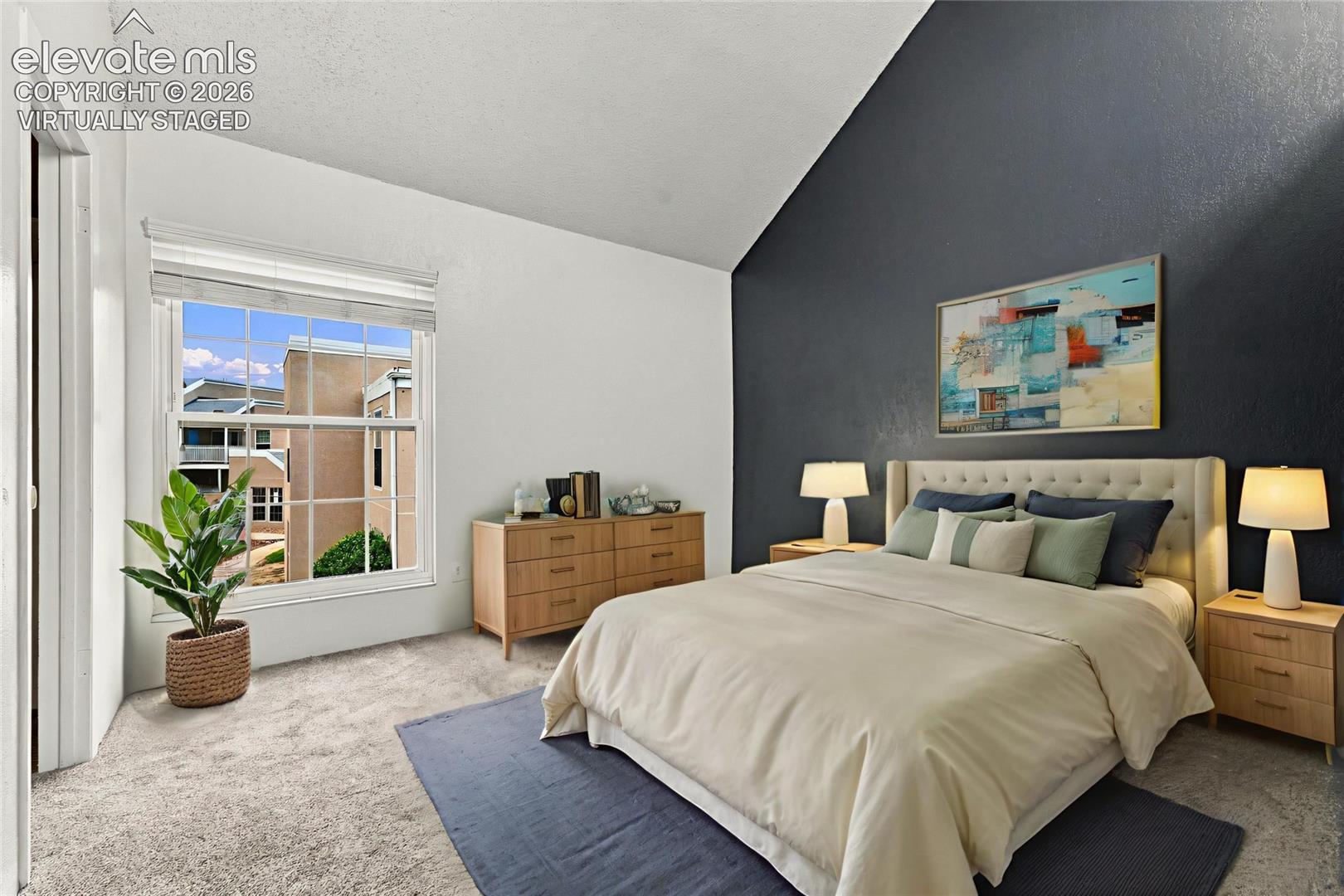 Vaulted ceiling, dark-toned accent wall, and large double-hung window
Virtually Staged