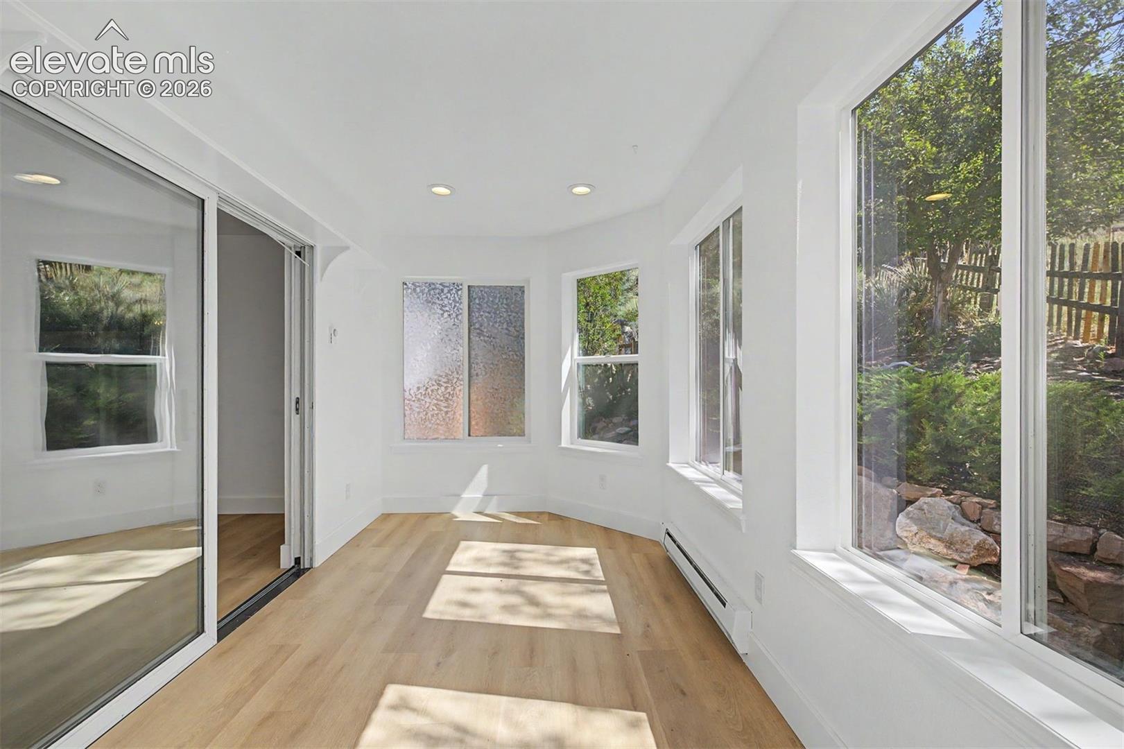 Sunroom off of living room with walkout access