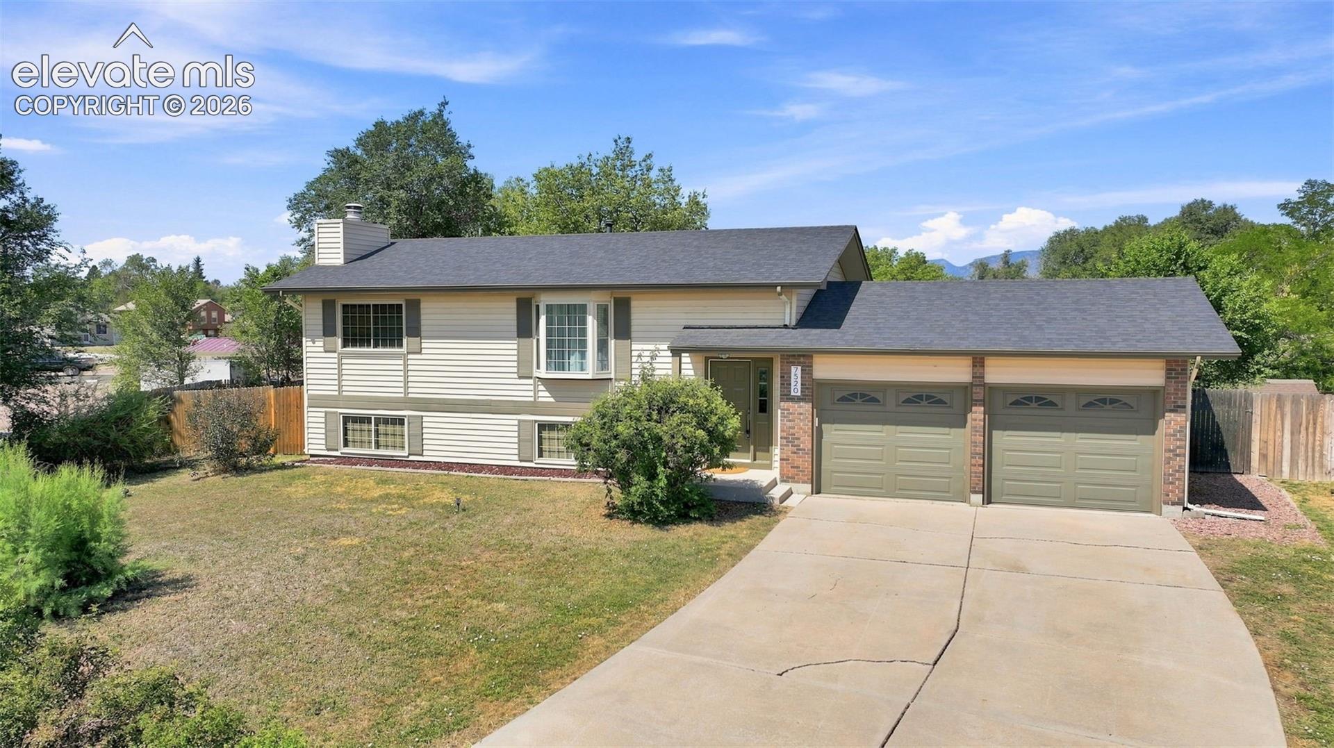 Huge 1/4 acre lot offers space in front and around the home