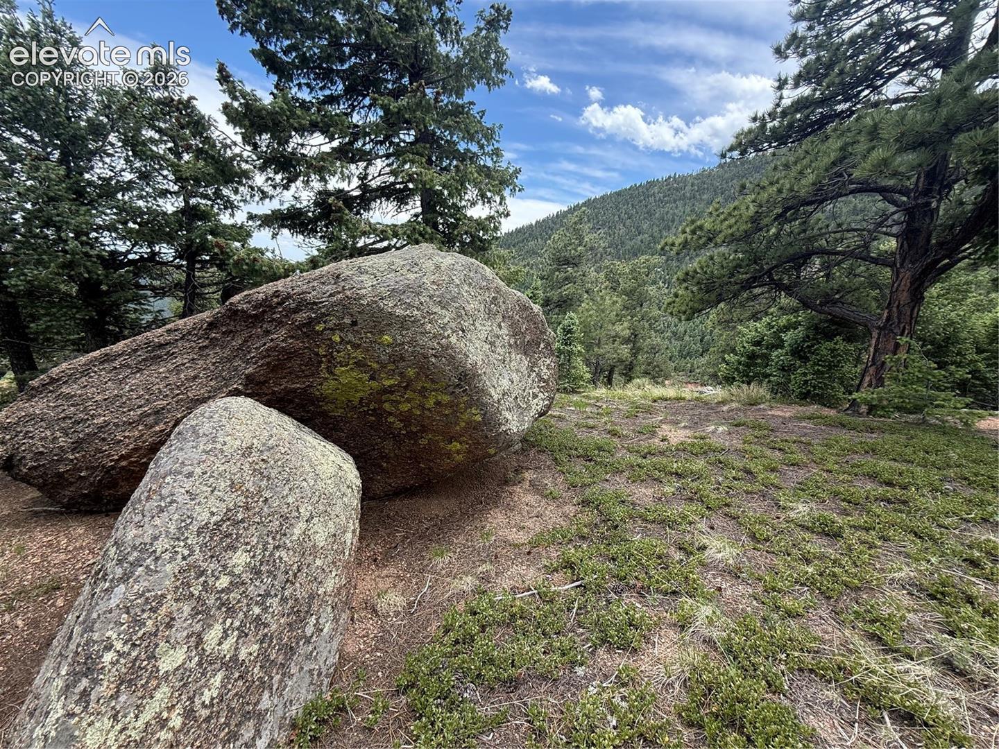 Rock outcroppings with mountain views behind