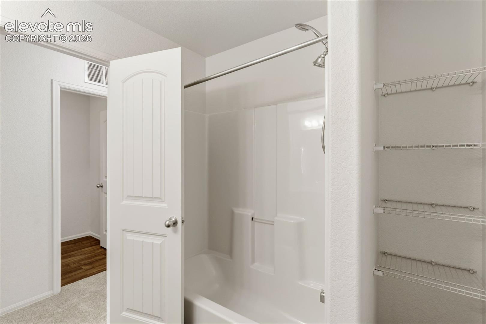 A second upper-level full bathroom ensures flexibility and convenience for family members or overnight guests