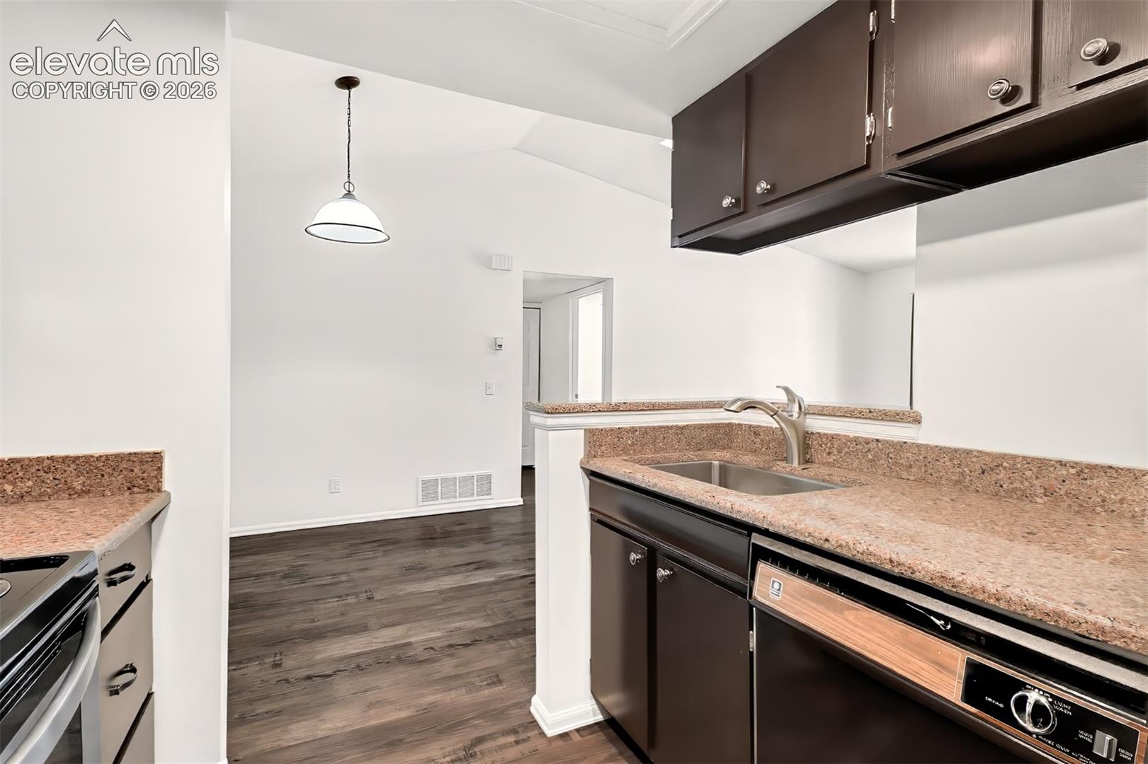 Large stainless steel sink with newer faucet. 