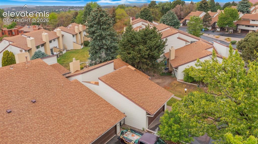 Aerial perspective showcasing a residential community with numerous townhome-style units