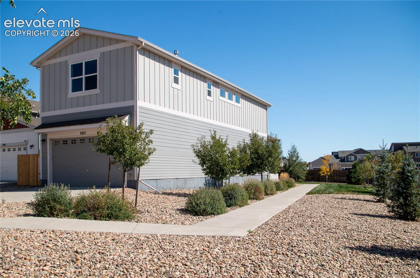 side of house with 2 car garage