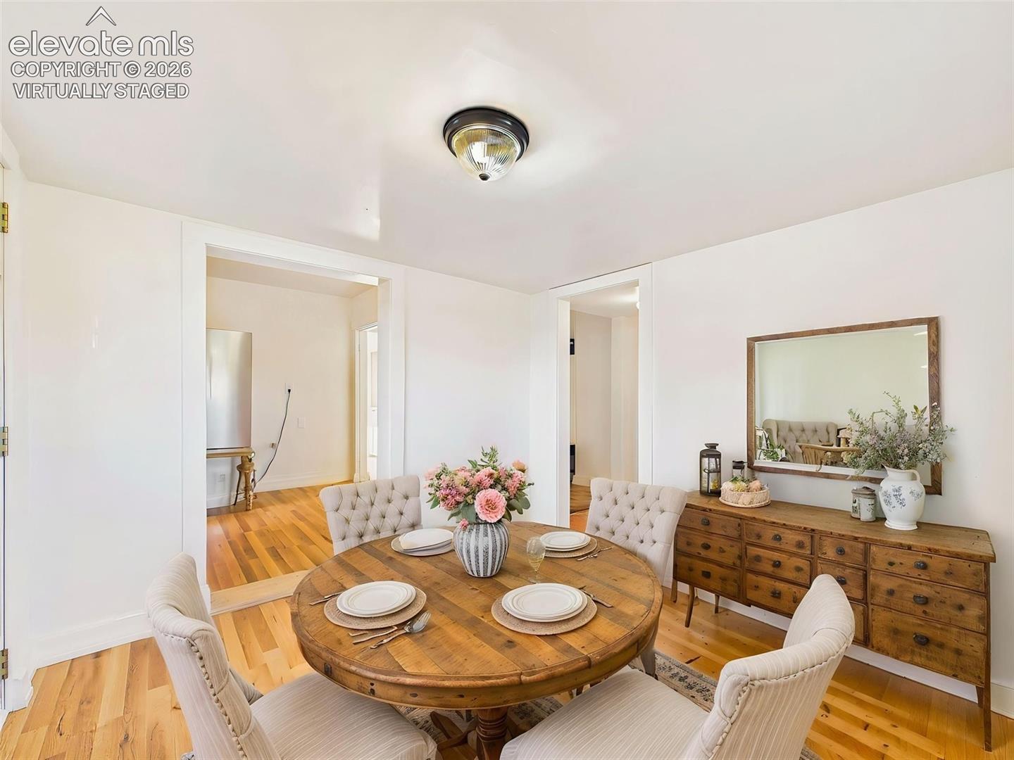 (Virtually Staged) Dining Room – Bright dining space comfortably accommodates family and guests, creating an inviting setting for everyday meals and special occasions.