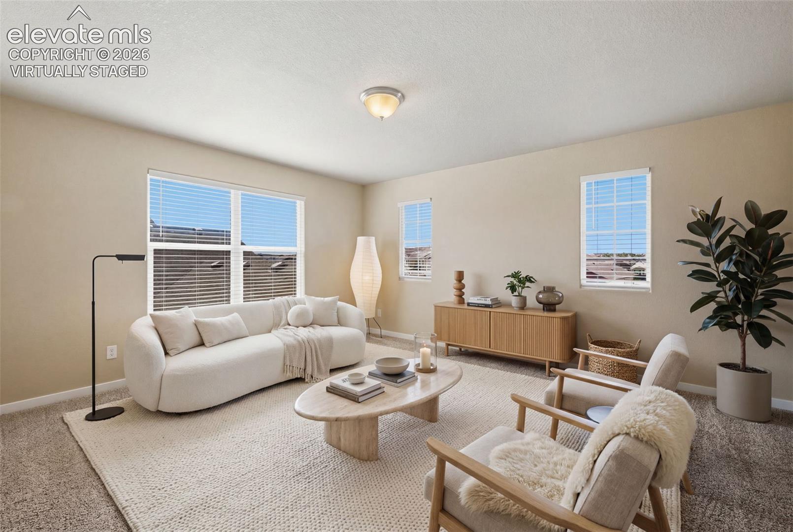 Virtually staged to demonstrate the loft as a comfortable second living, media, study or gaming space.