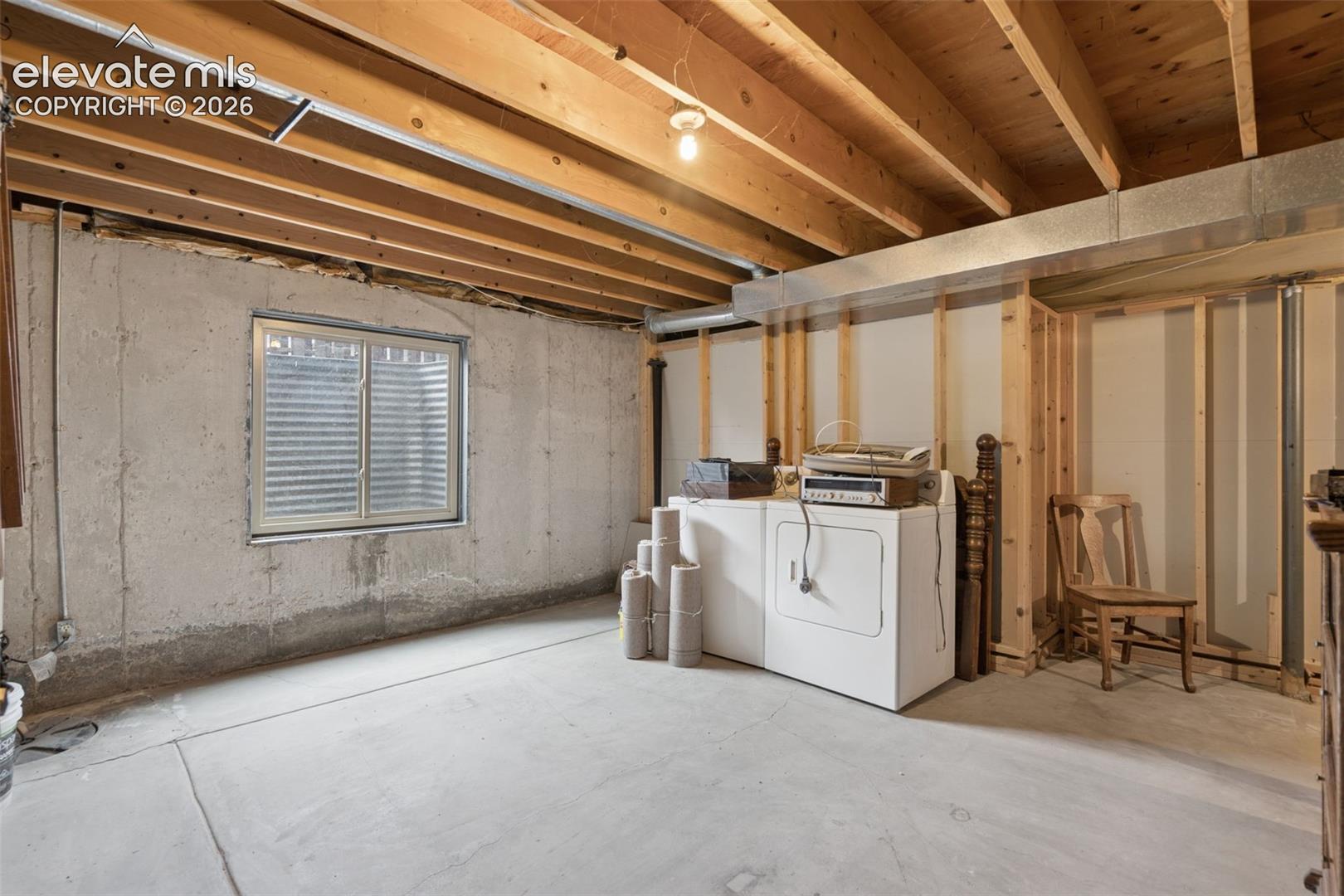 Unfinished portion of basement provides ample storage, washer & dryer and could be converted to work out and/or craft room 