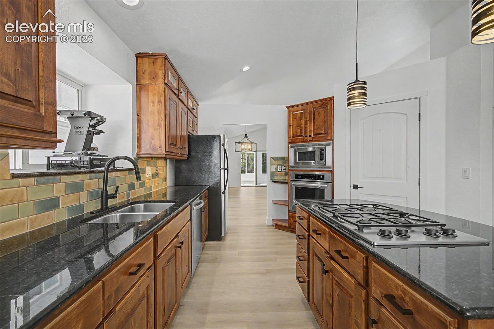 Kitchen with large center island and gas range