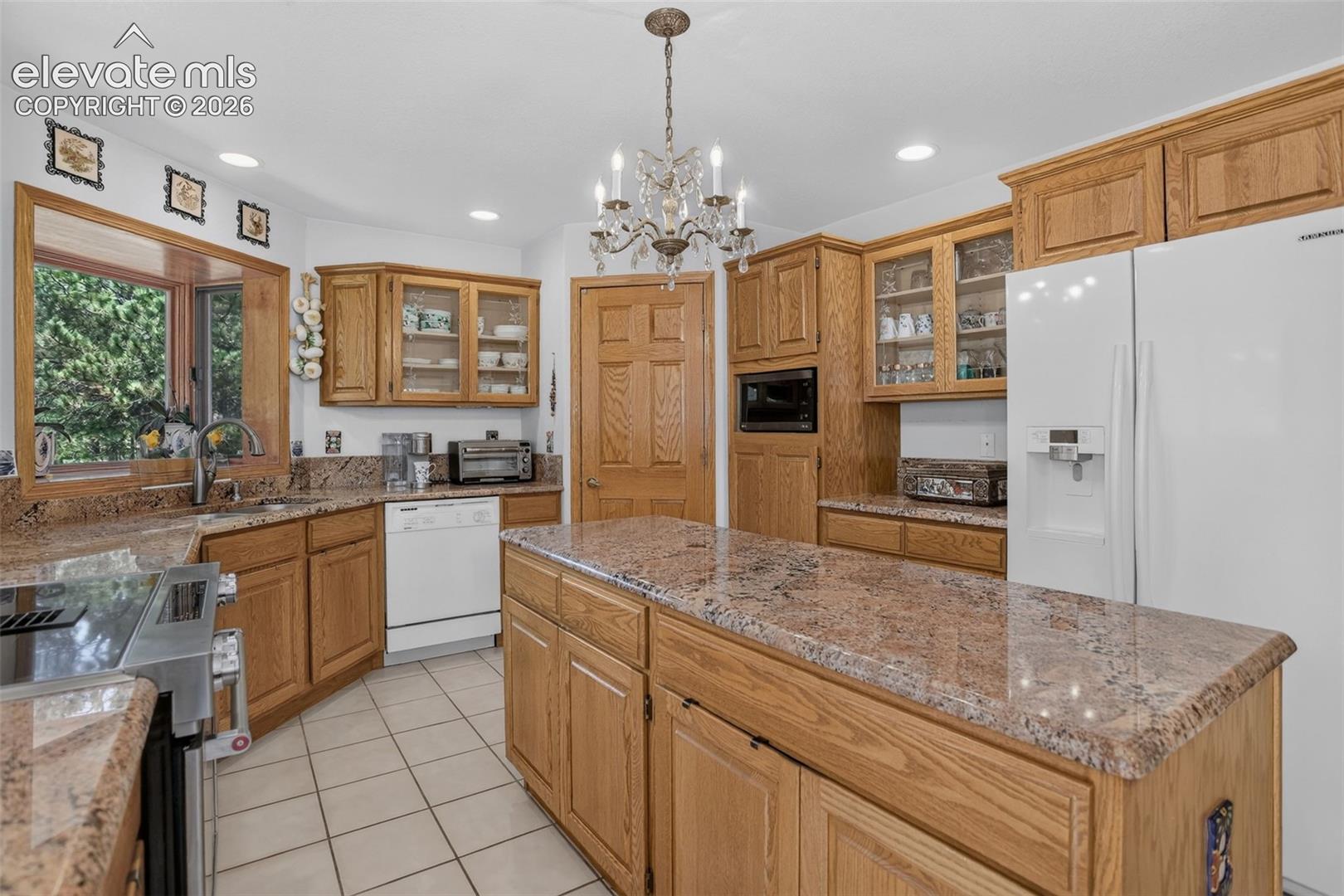 Kitchen with 6' island and box window over sink.