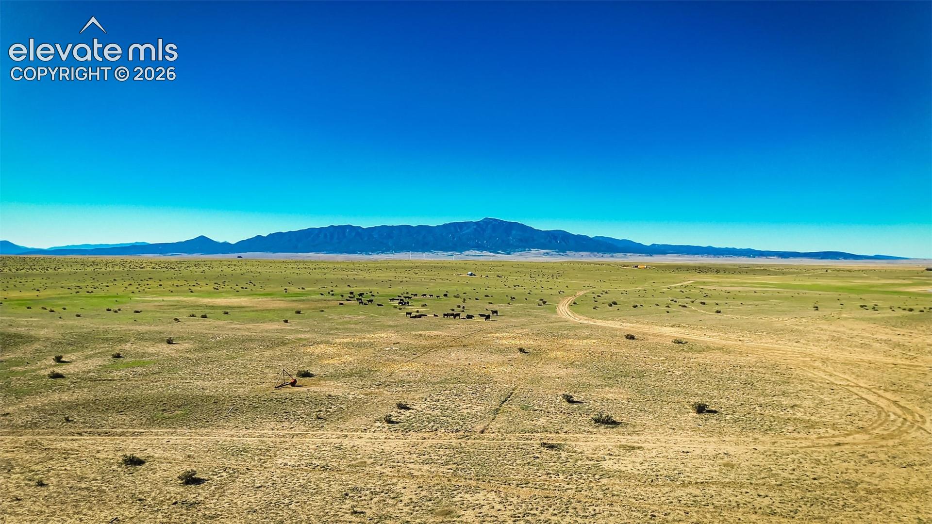 Expansive acreage featuring native terrain, unencumbered horizon, and a prominent mountain range backdrop
