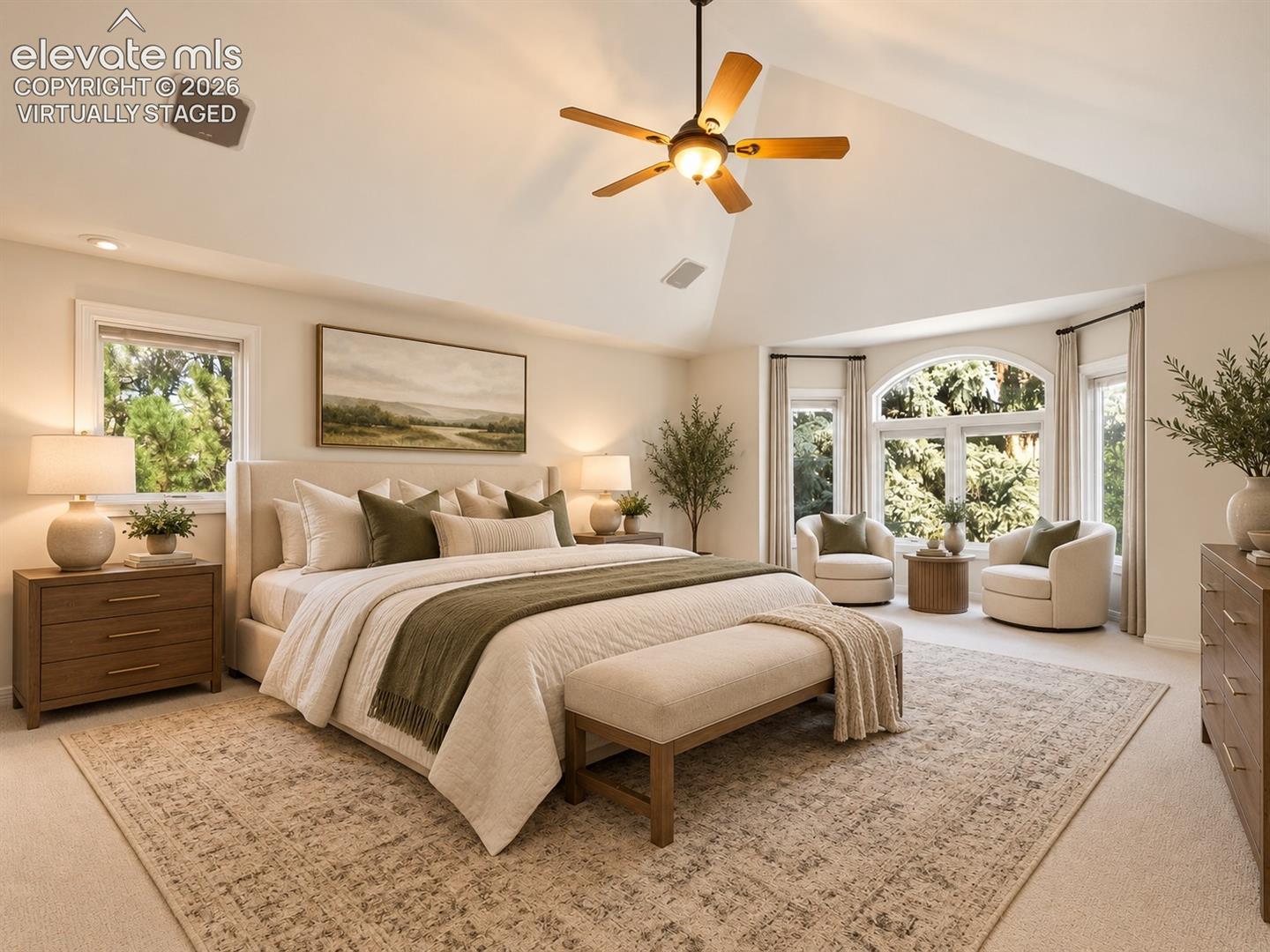 Vaulted ceiling featuring a central lighted ceiling fan, expansive windows including an arched window element, and neutral carpeting- virtually staged