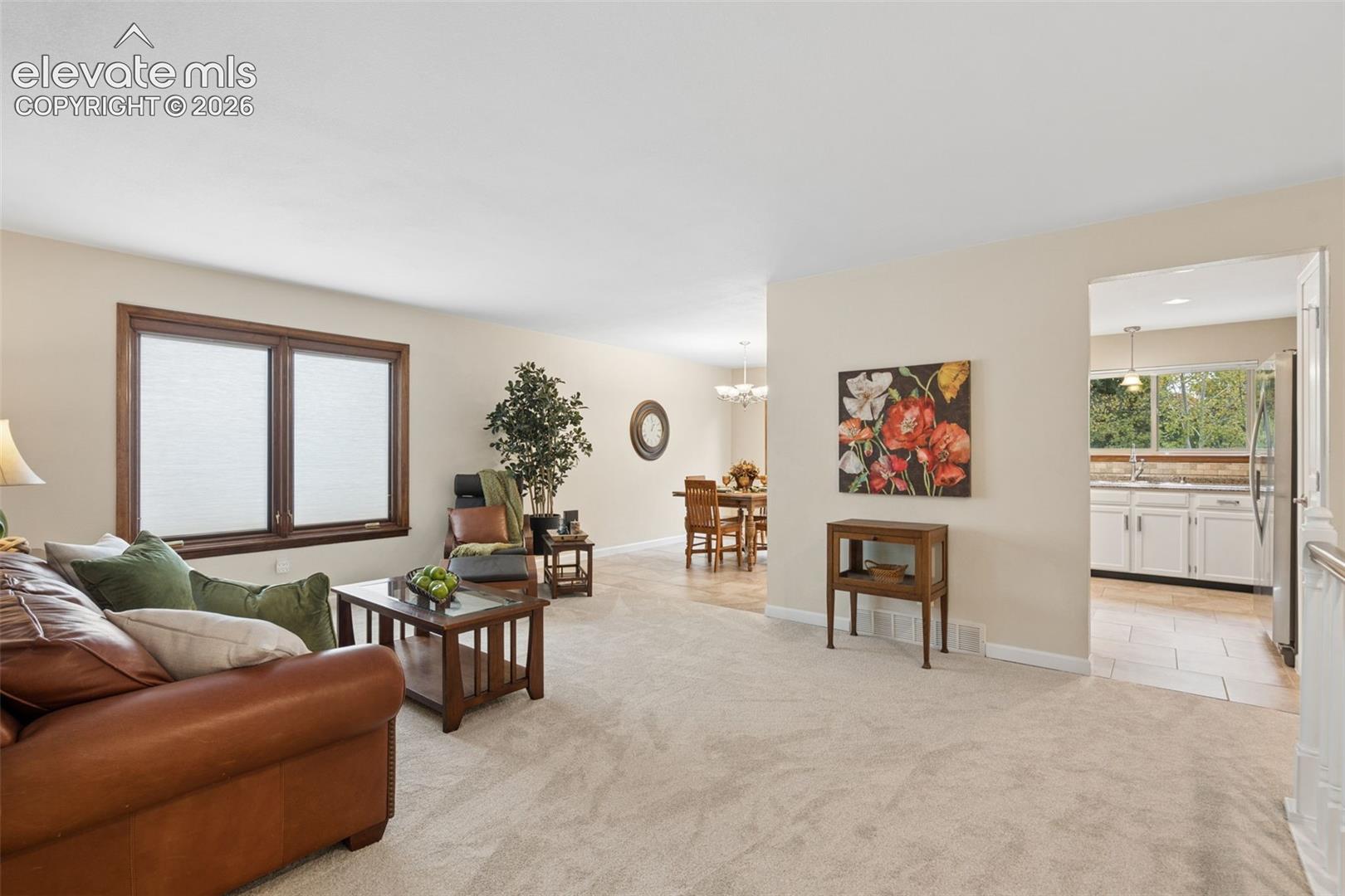 Living area joins dining and kitchen