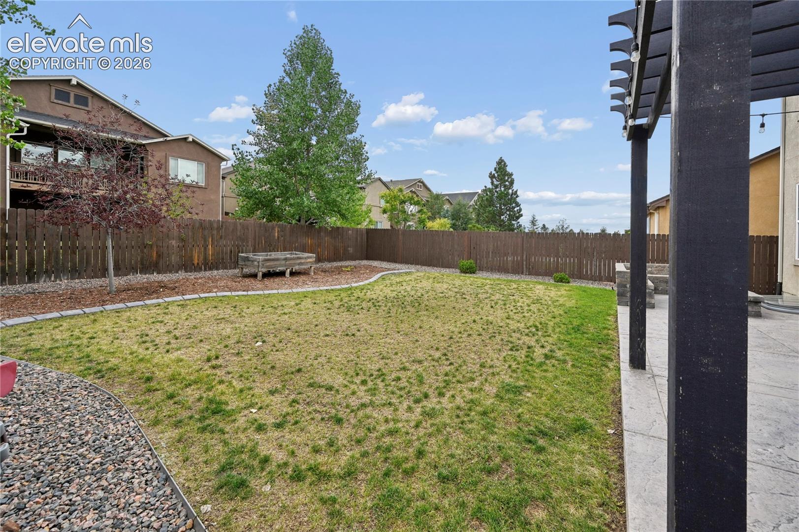 The automatic sprinklers are working to bring back the lawn, while the raised planter bed invites you to enjoy gardening either by yourself, or with the next generation of gardeners.