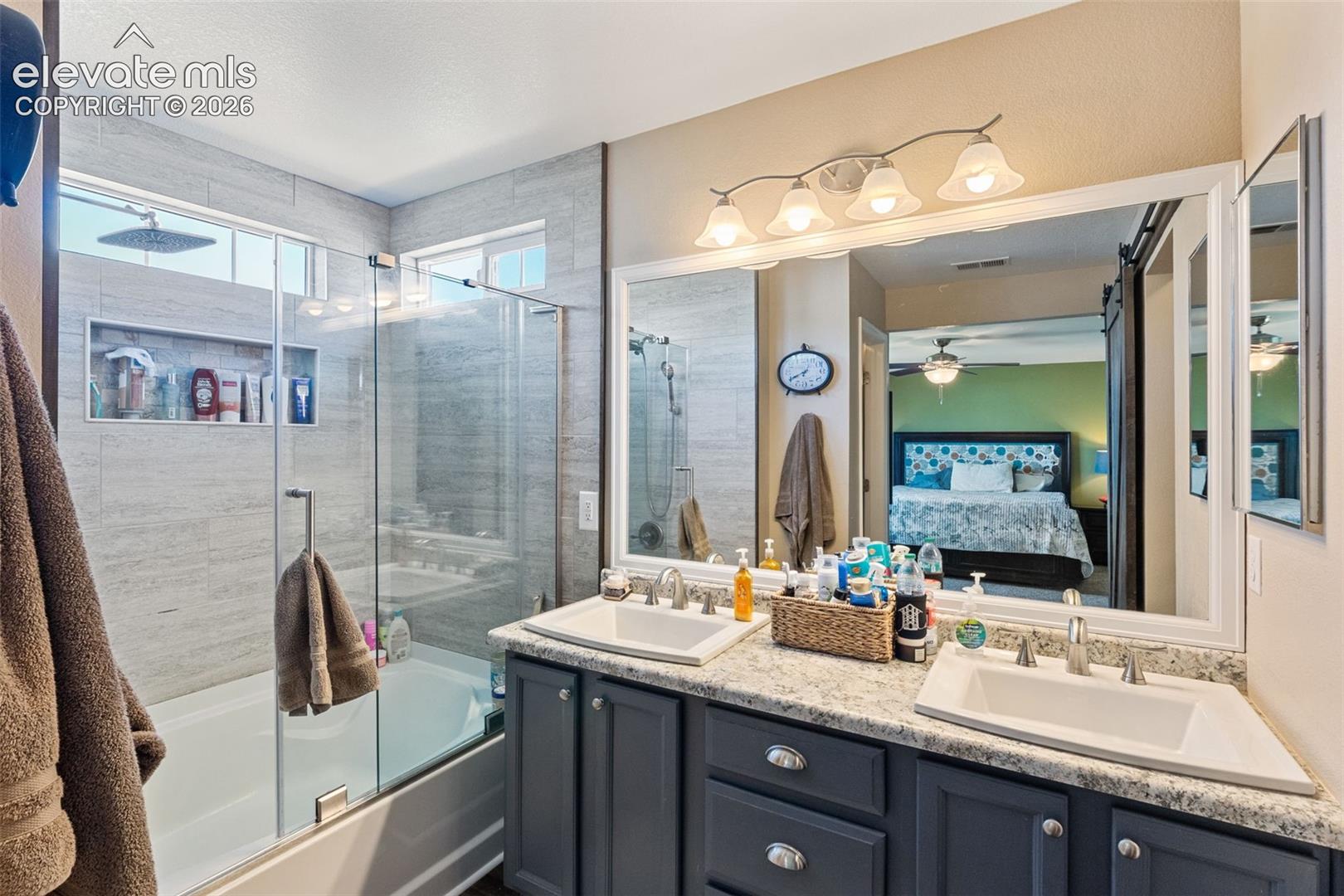 Master bath with double vanities,, shower and soaking tub.