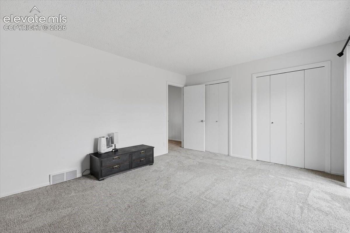 Unit 724 - Primary Bedroom with Dual Closets