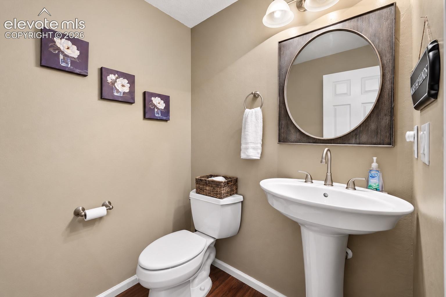 A convenient main-level powder bath is thoughtfully positioned for family and guests.