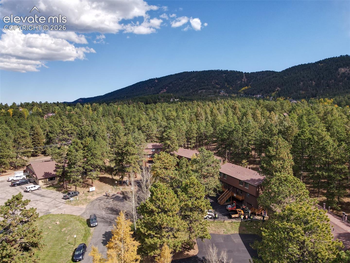 Expansive wooded landscape with multiple structures