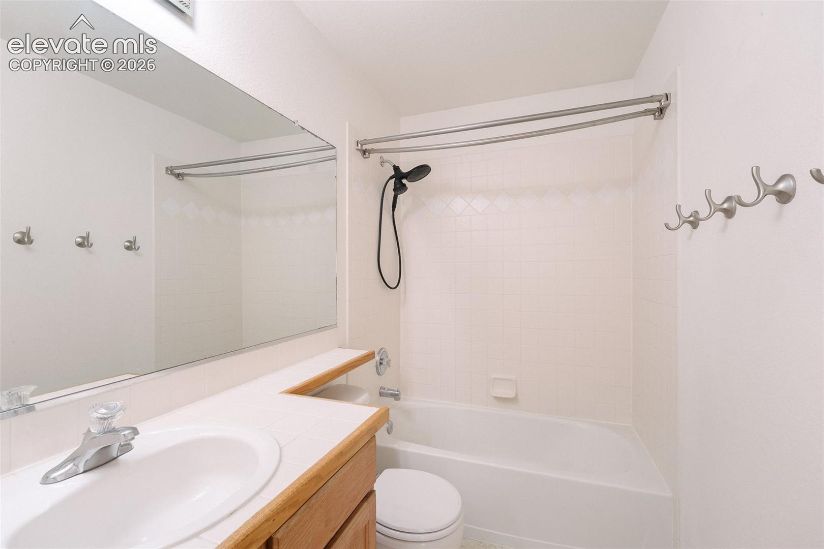 Integrated vanity with a single basin sink and laminate countertop