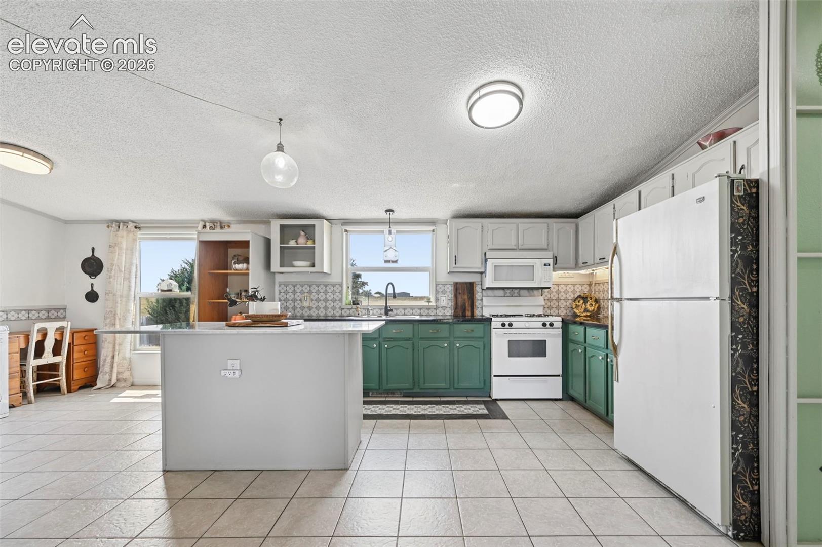 Bright and efficient Kitchen with beautiful tile floors!