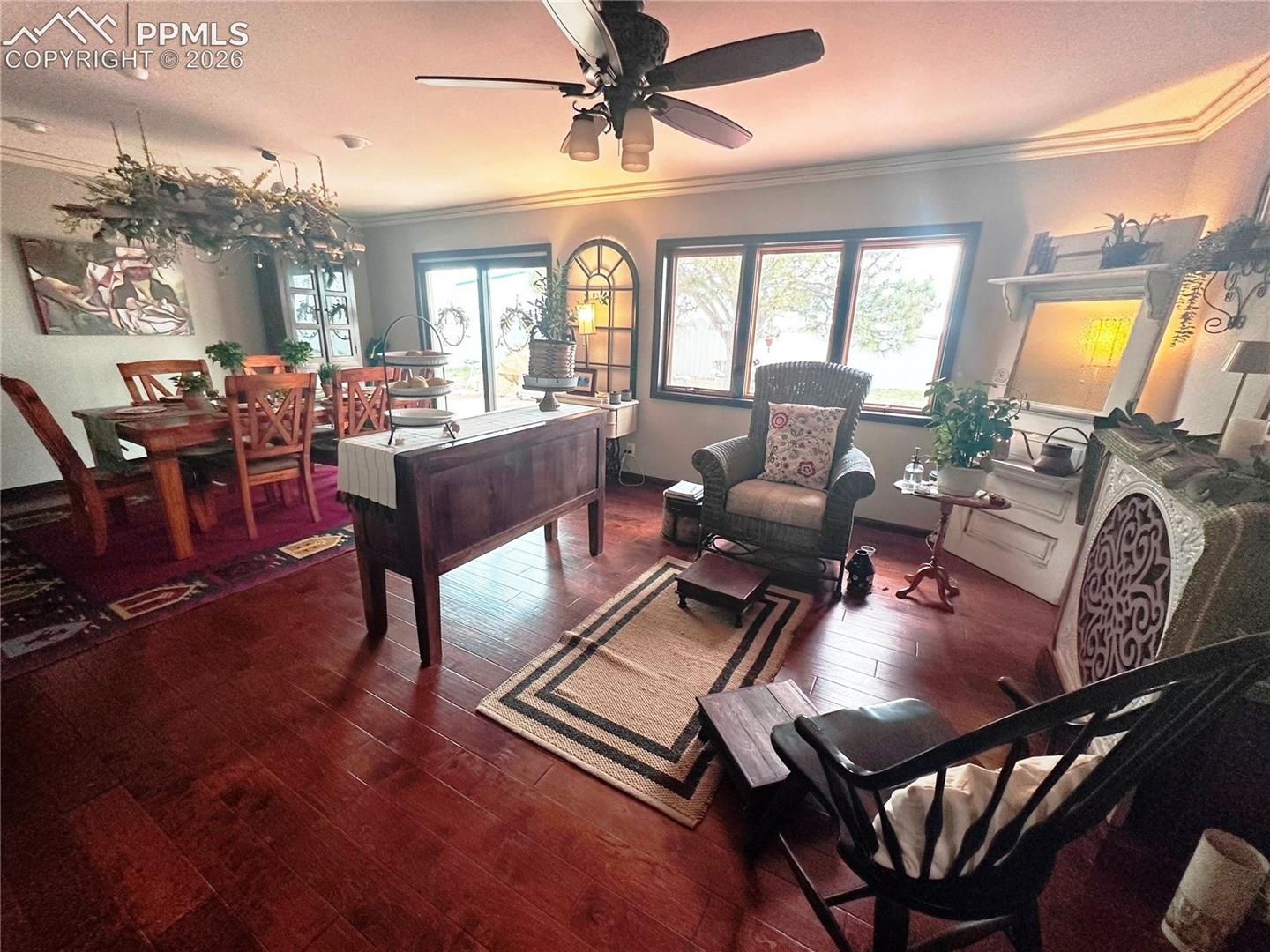 Shows sitting and reading area adjacent to Dining table and patio door.
