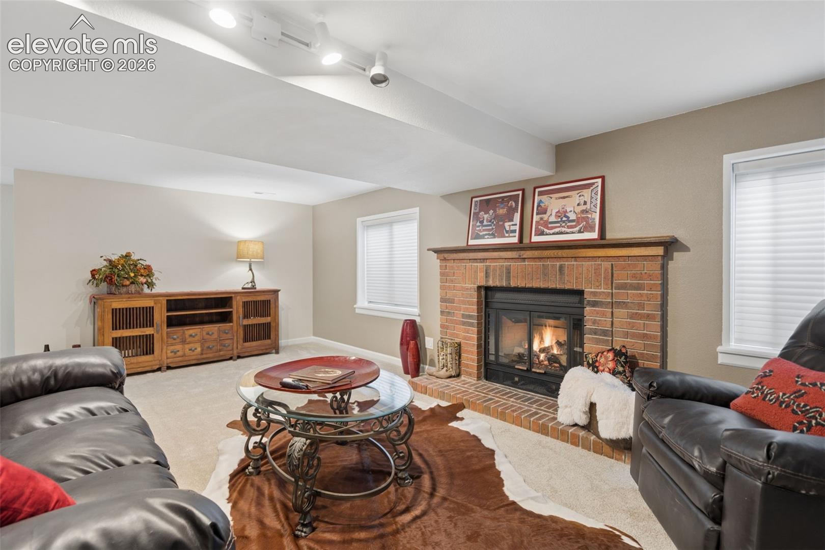 Spacious family Room w/fireplace and adjustable track lighting