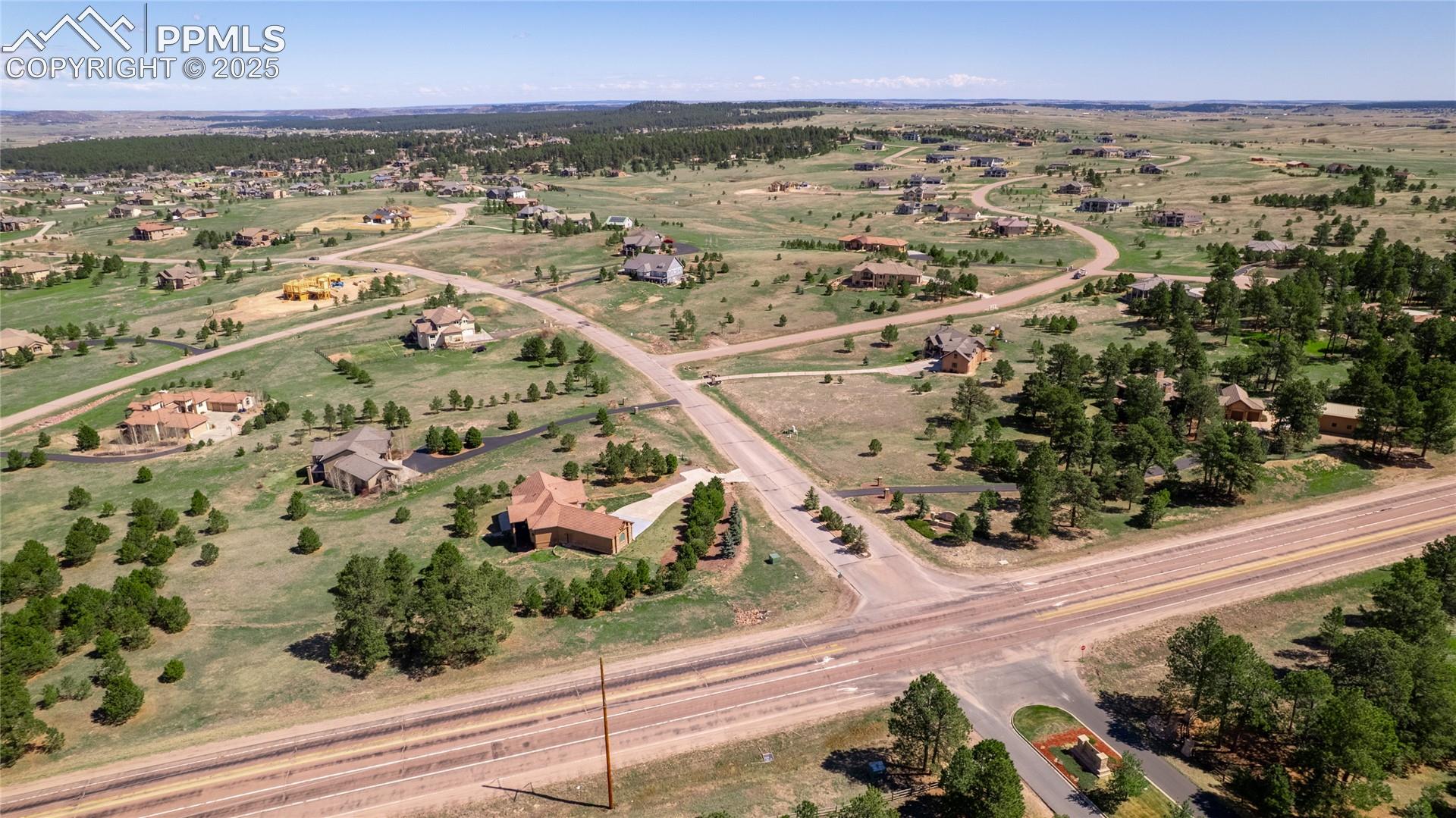 Birds eye view of property featuring a rural view