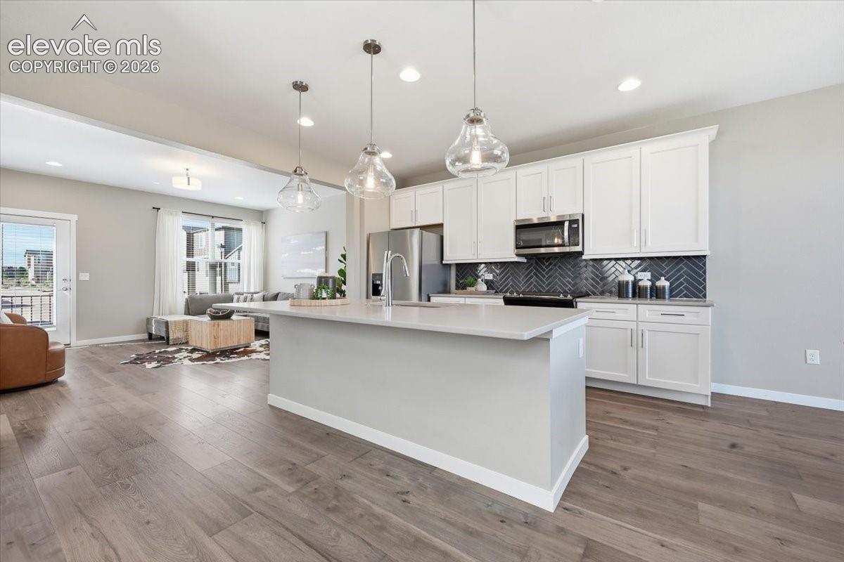 Large kitchen with upgraded appliances and gas range! White cabinets!