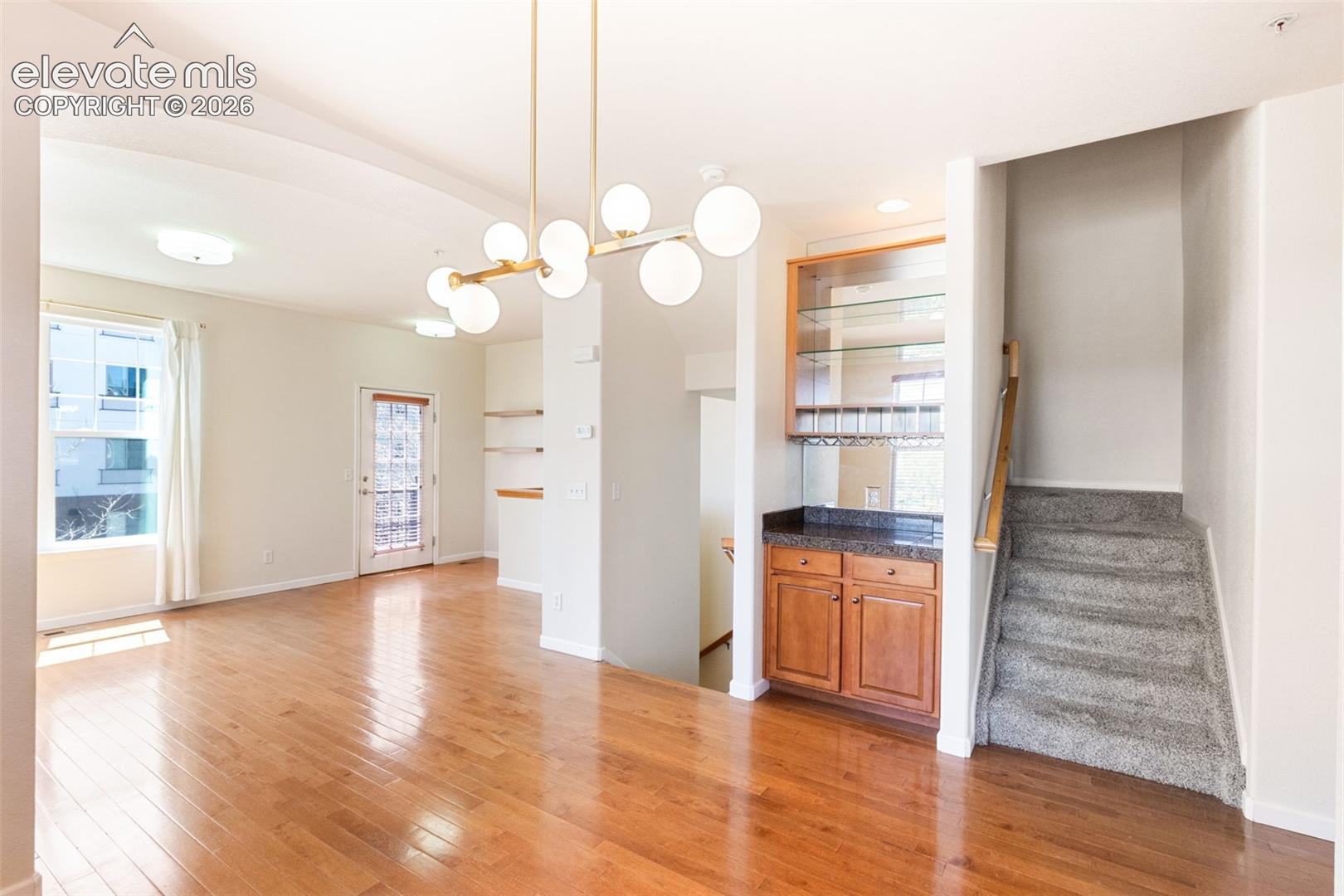 Open to living room with dry bar 