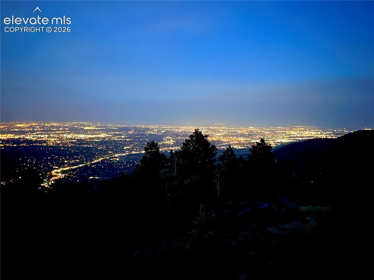 View of the city lights at night from the lot