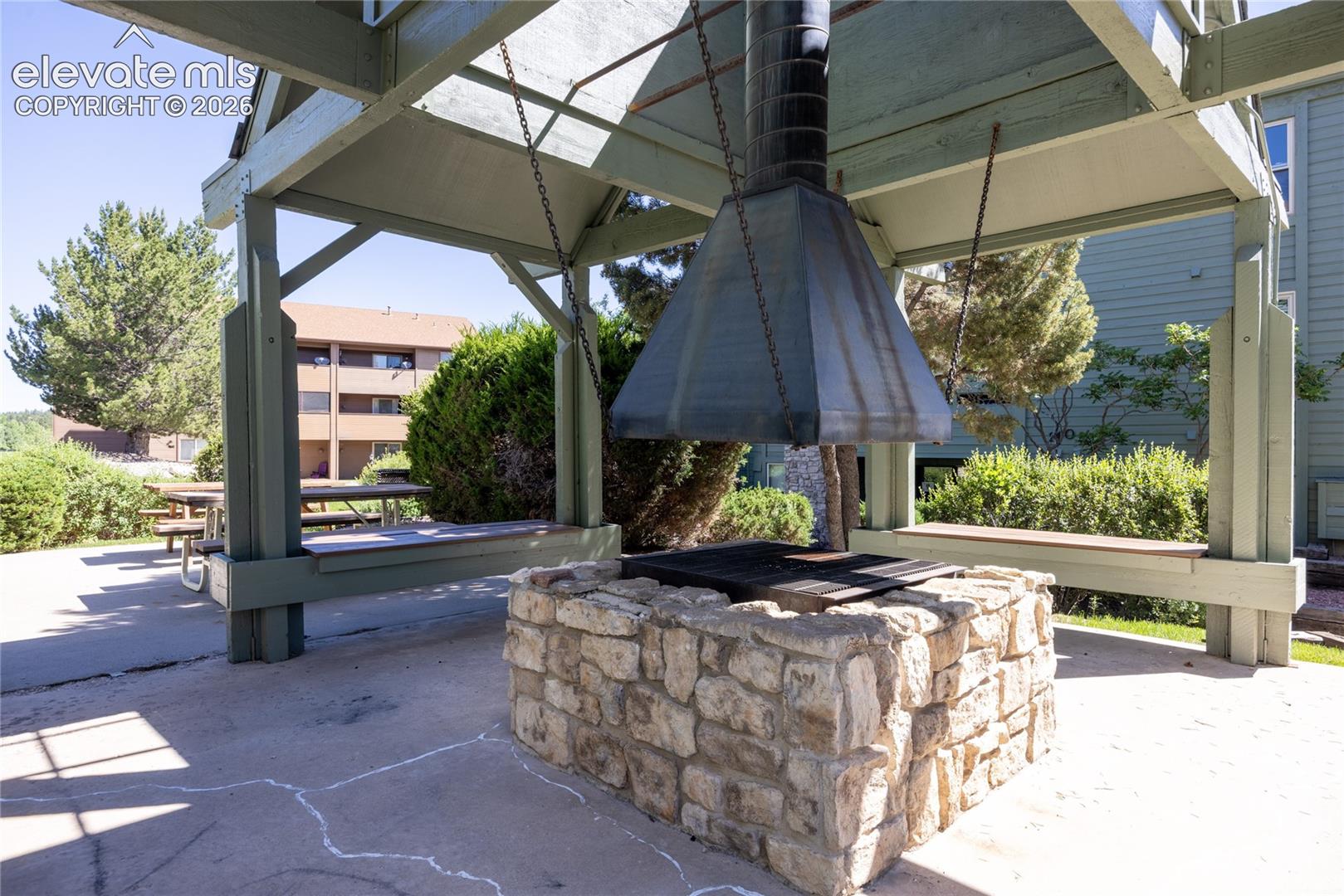 Firepit conveniently situated near the pool and the condo.