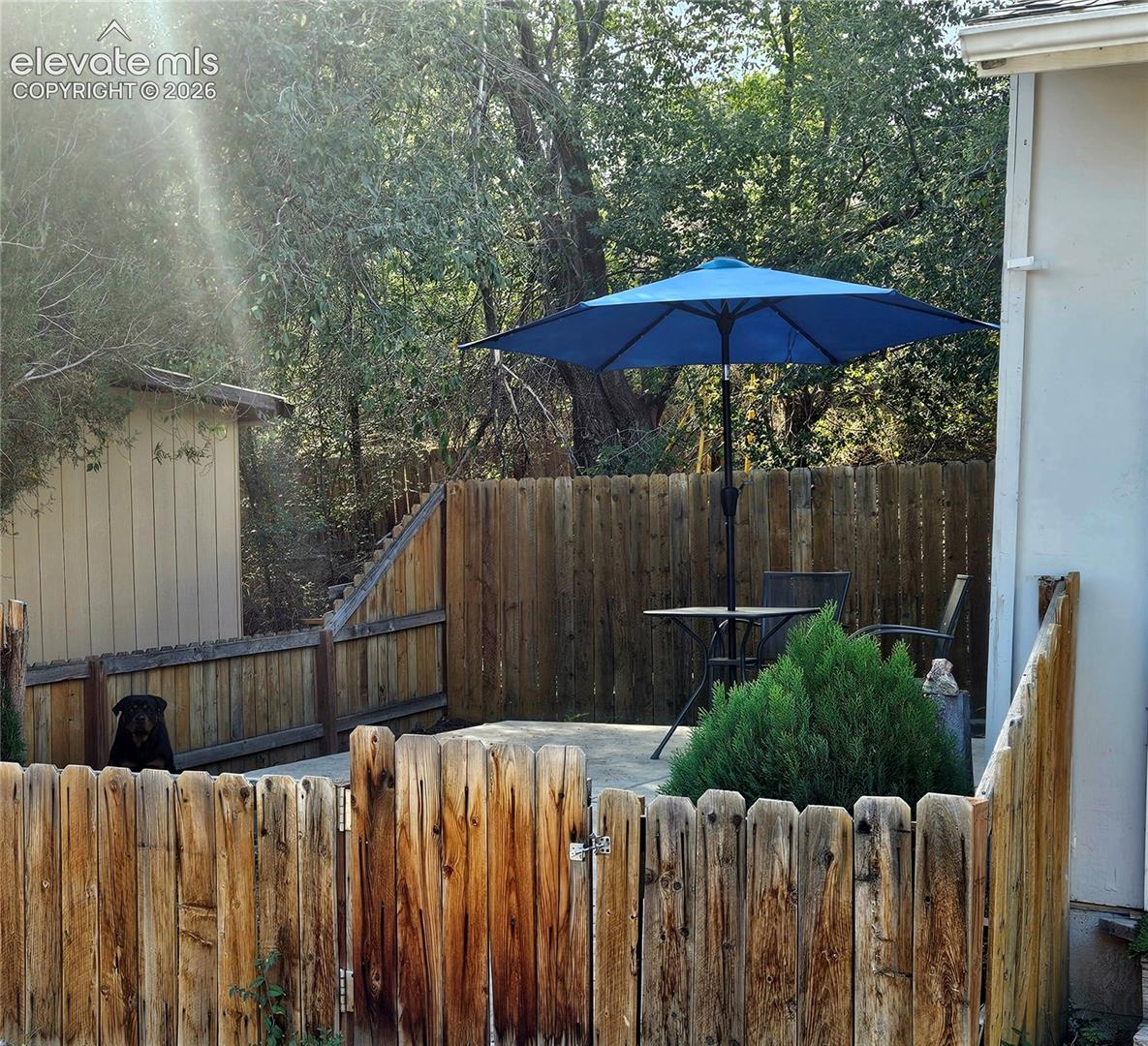 Unit B fenced in private patio and yard