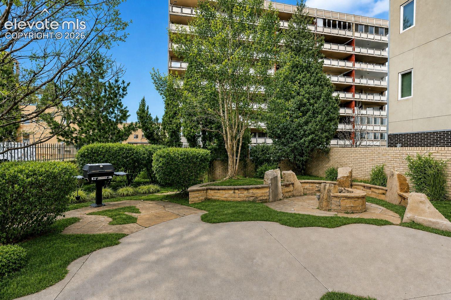 View of Firepit and Grills in secured Pool area (enhanced photo)