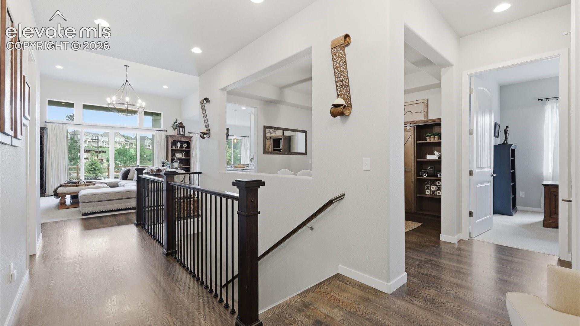 A GRAND FIRST IMPRESSION — A welcoming entry foyer and beautifully designed hallway set the tone for the sophisticated spaces that await throughout the home.