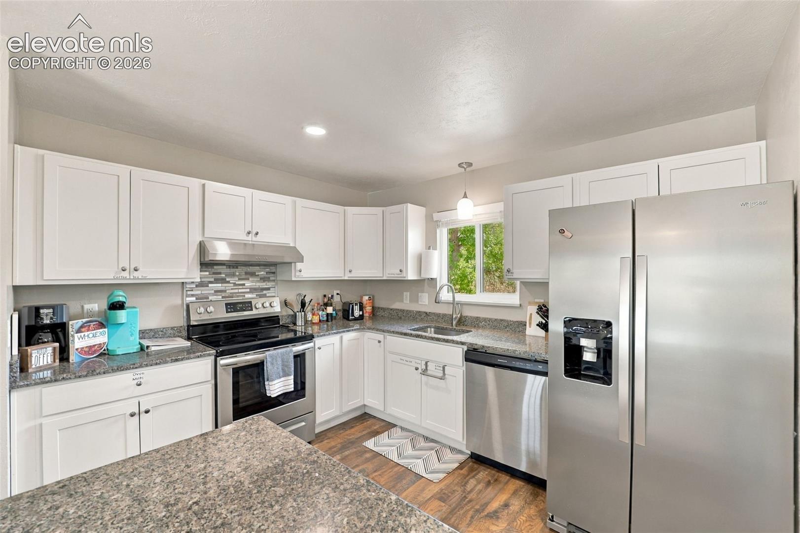 Enjoy the updated kitchen with stainless steel appliances and granite countertops!