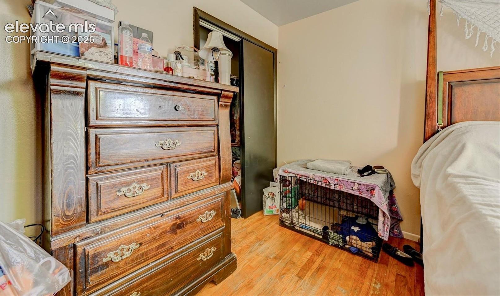 Wood-finish flooring and closet with sliding doors
