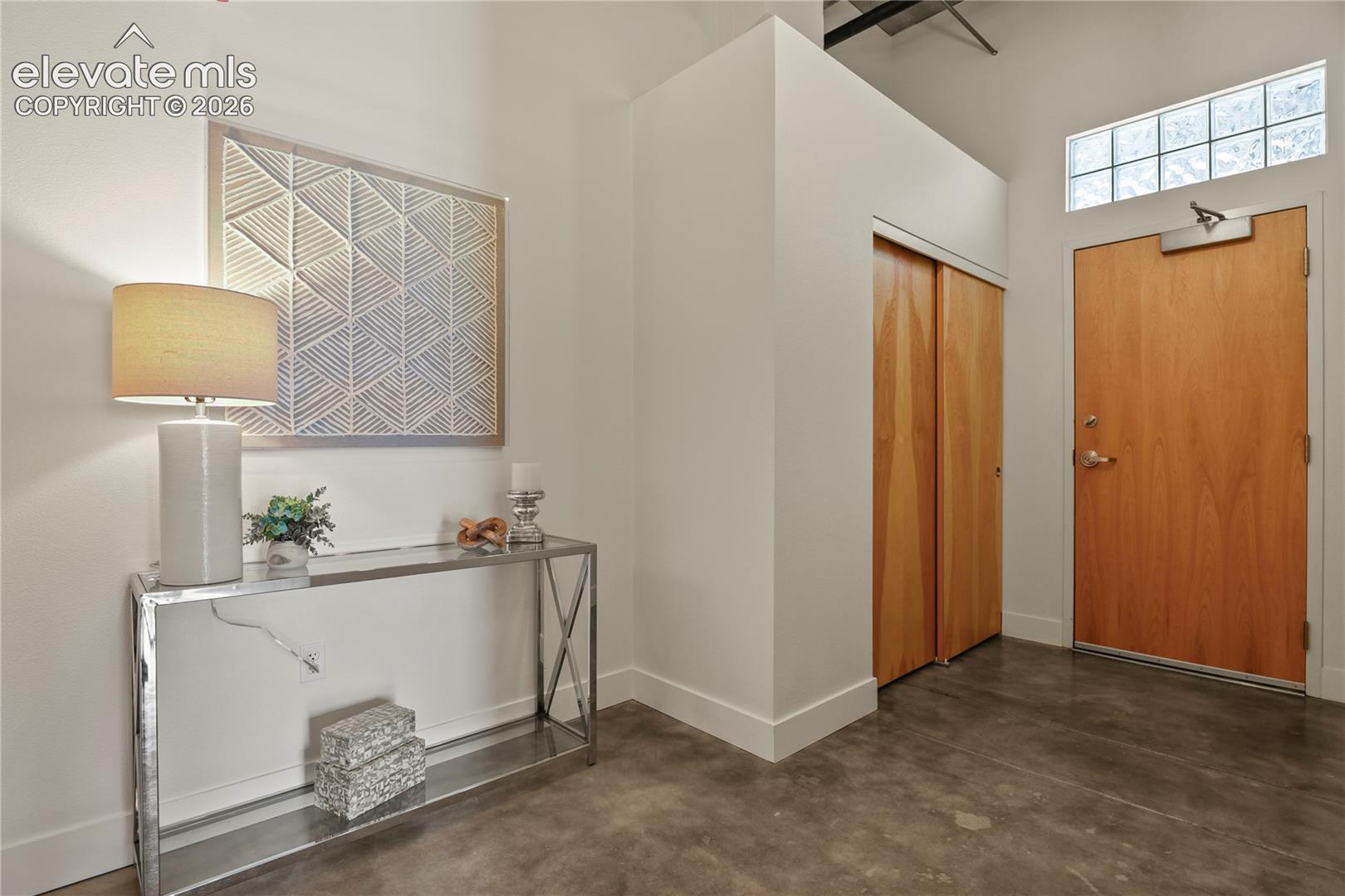 Entry with double size coat closet and welcoming foyer
