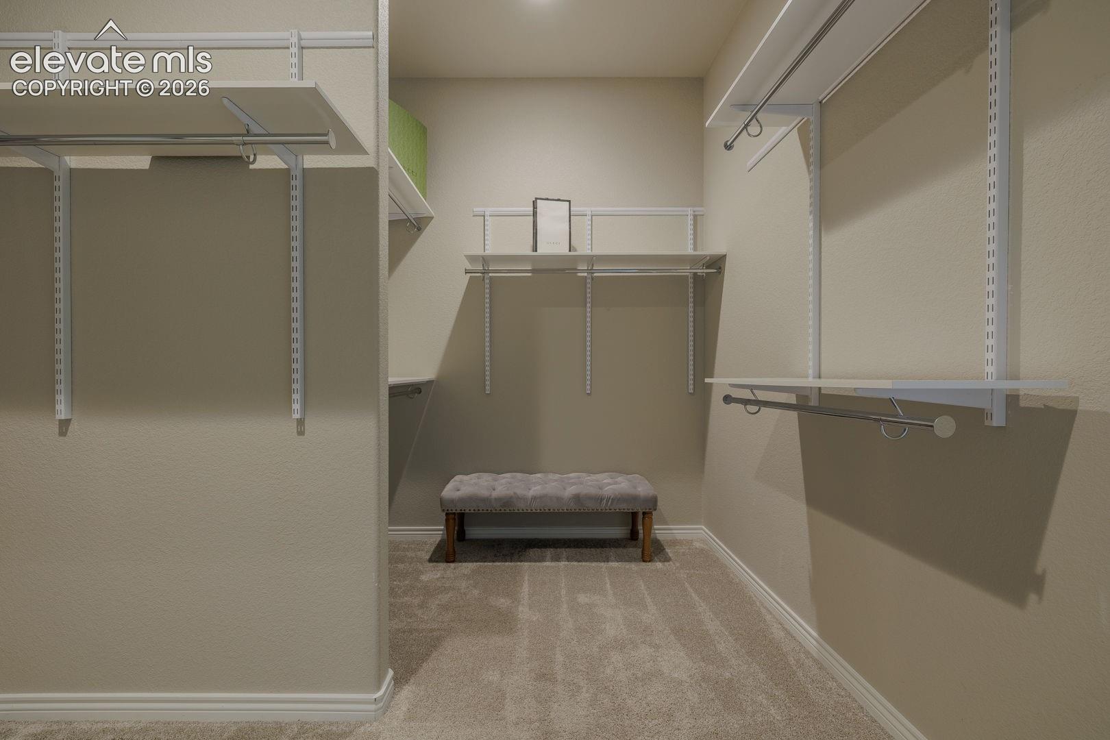 Main bedroom LARGE wak in closet. Circles over to the main level laundry room