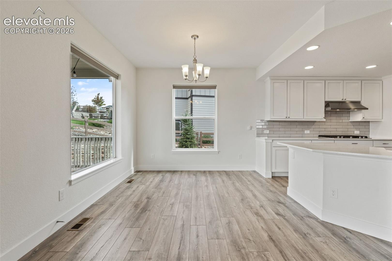 Breakfast nook attached to the kitchen and living room 