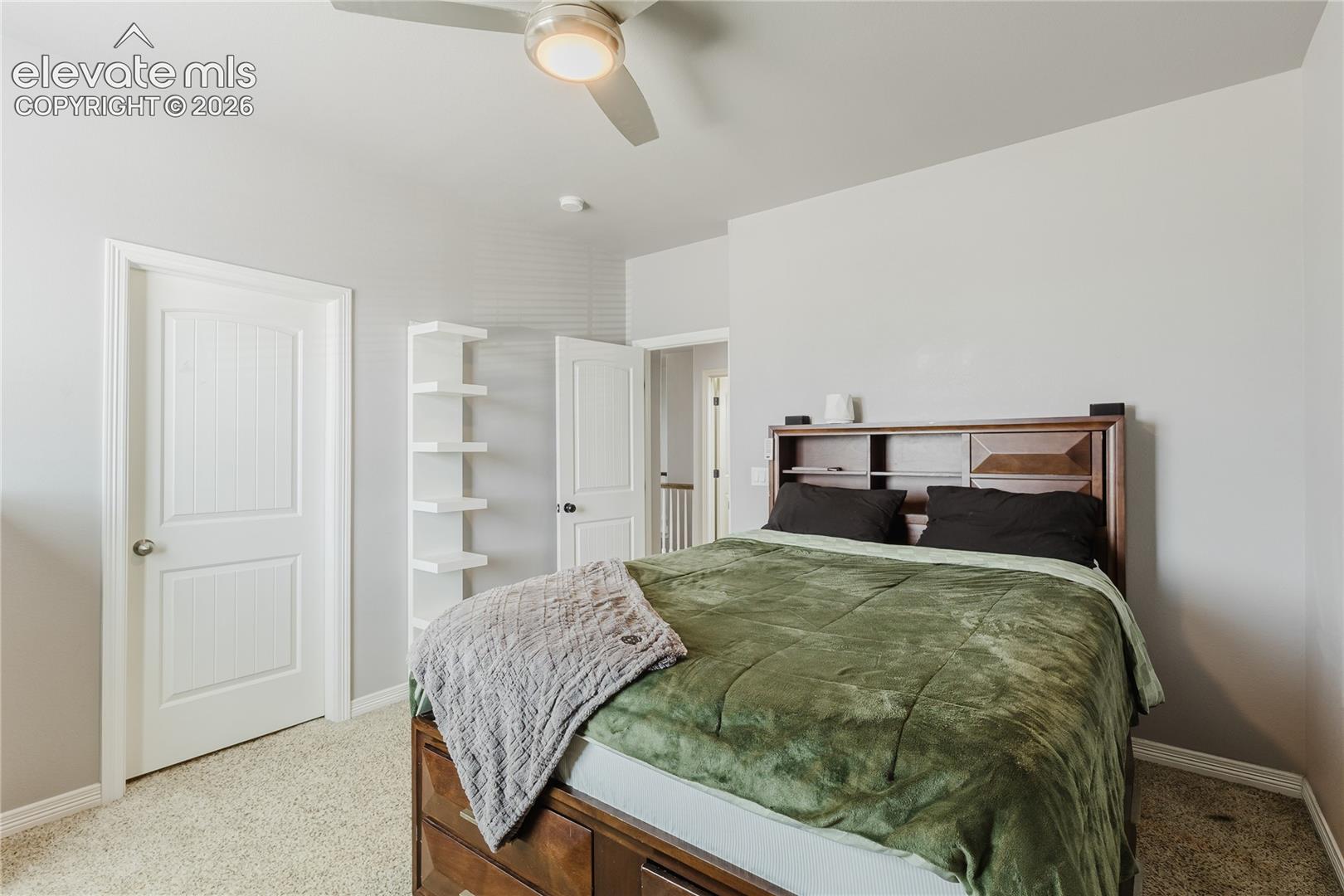 Neutral tone wall paint with a built-in ceiling fan and light fixture