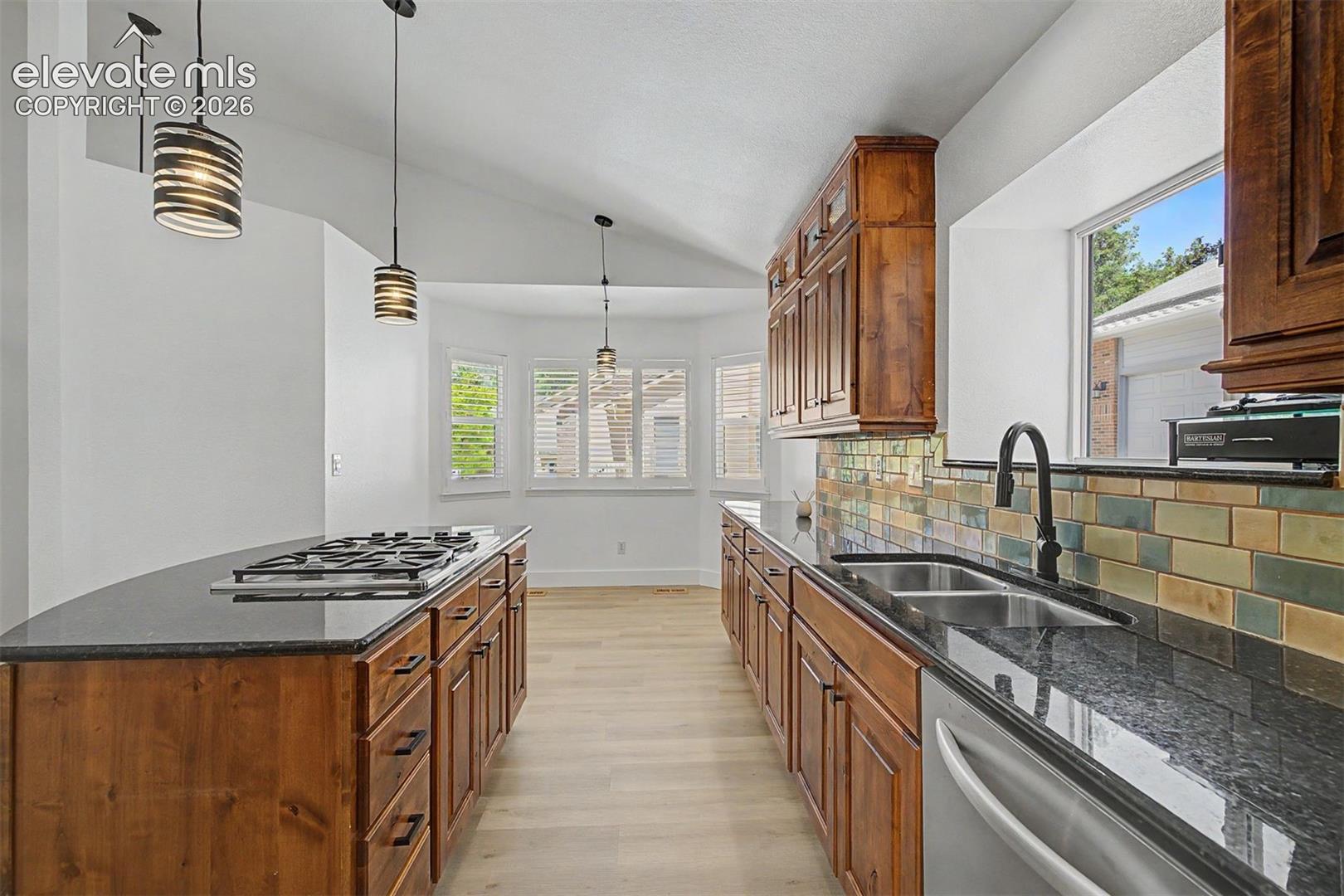 Kitchen with large center island and gas range