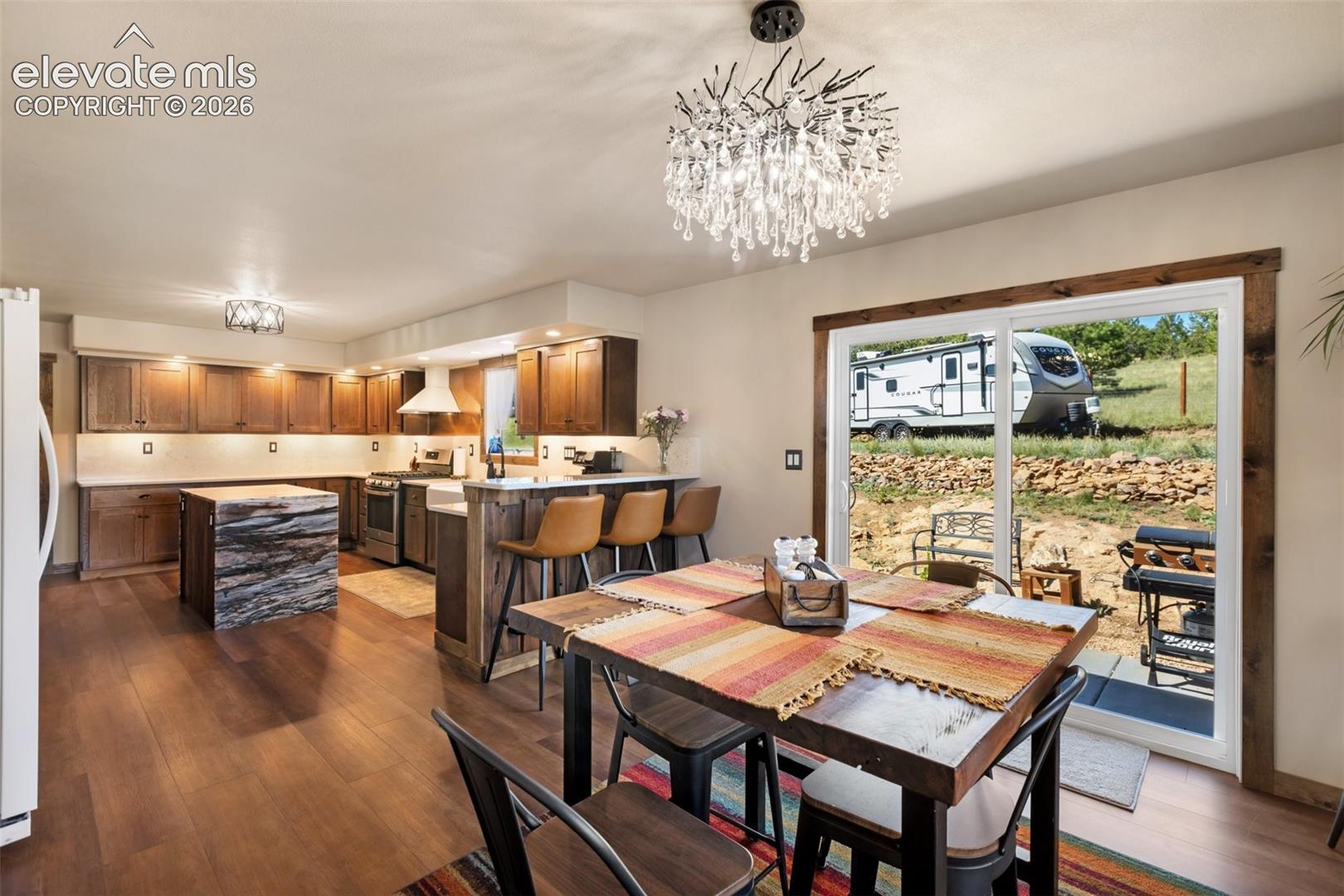 Open flow from the kitchen to the dining room with walk-out.