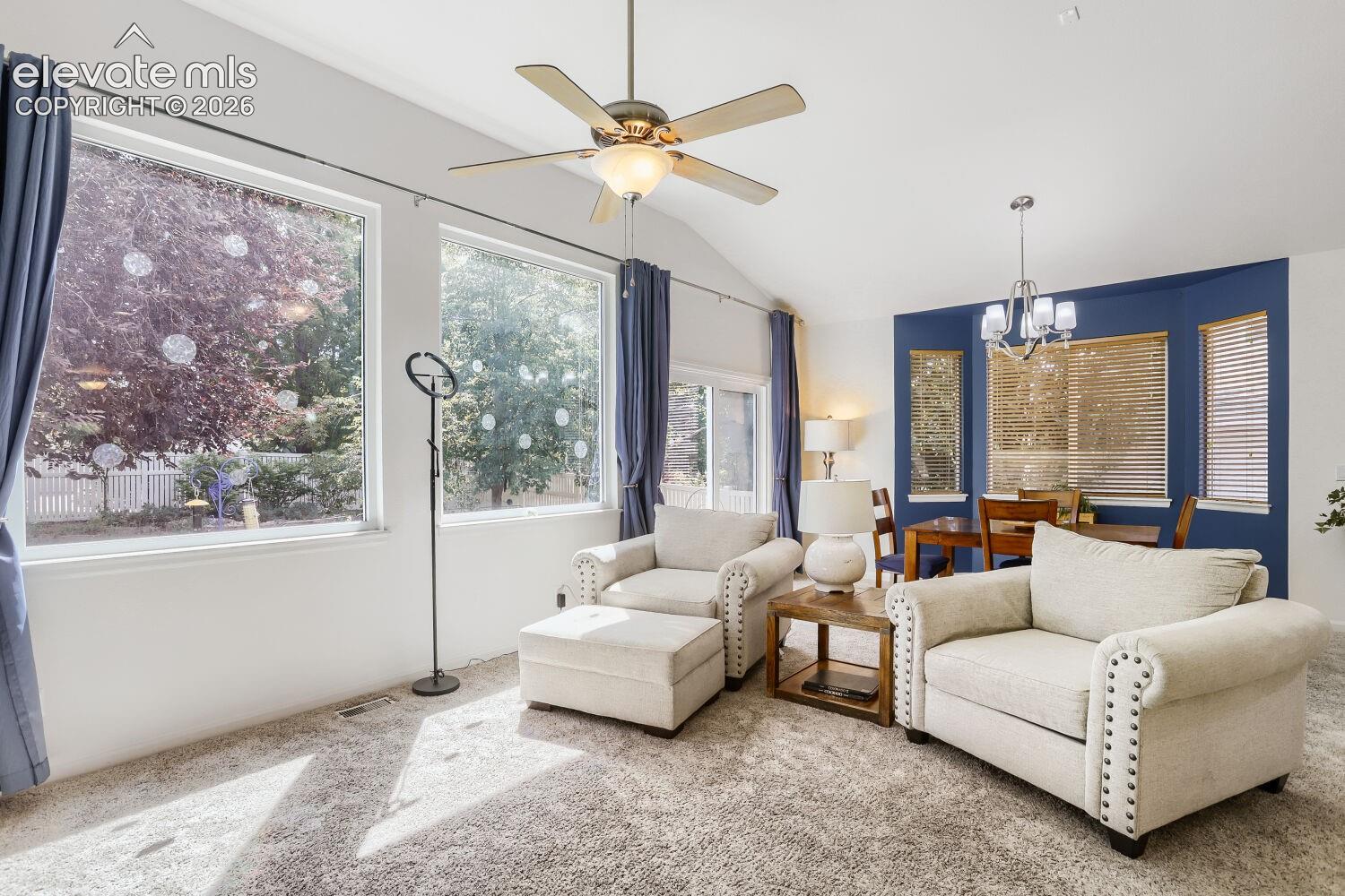 Natural light and a lovely view of the landscaped backyard from the upgraded picture windows.