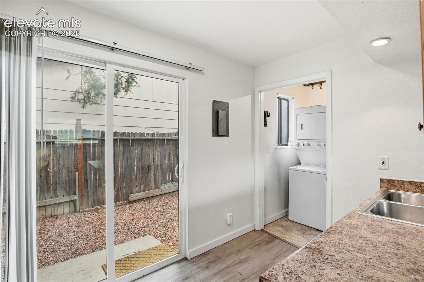 Walk Out from Kitchen to Fenced Patio Area