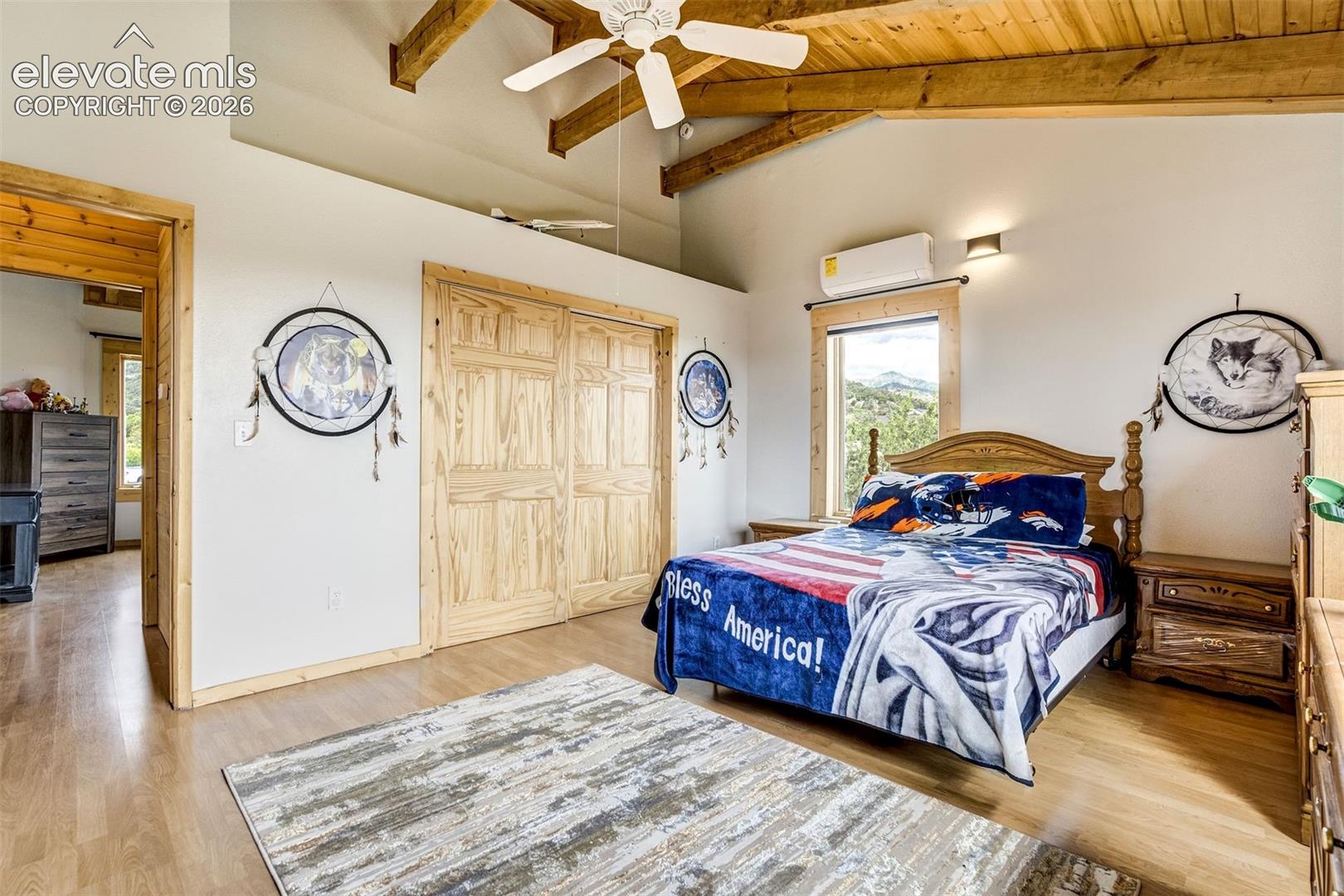 Vaulted wooden plank ceiling with exposed beams