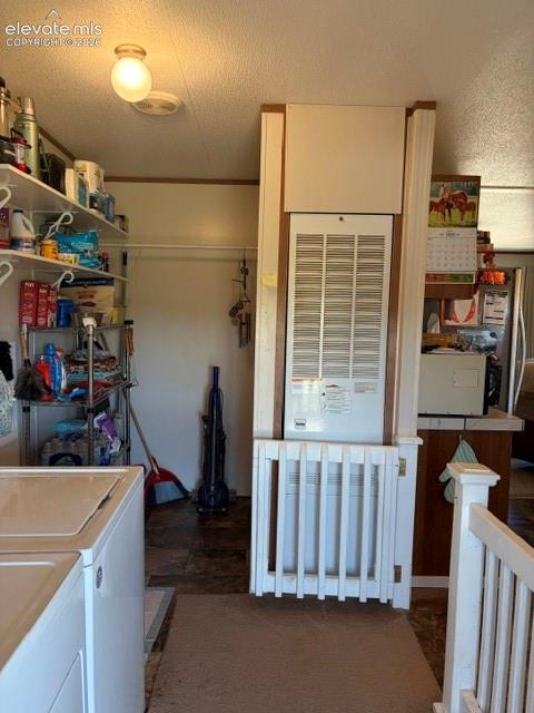 Mudroom/Laundry with gate to close off space for pets or littles. 