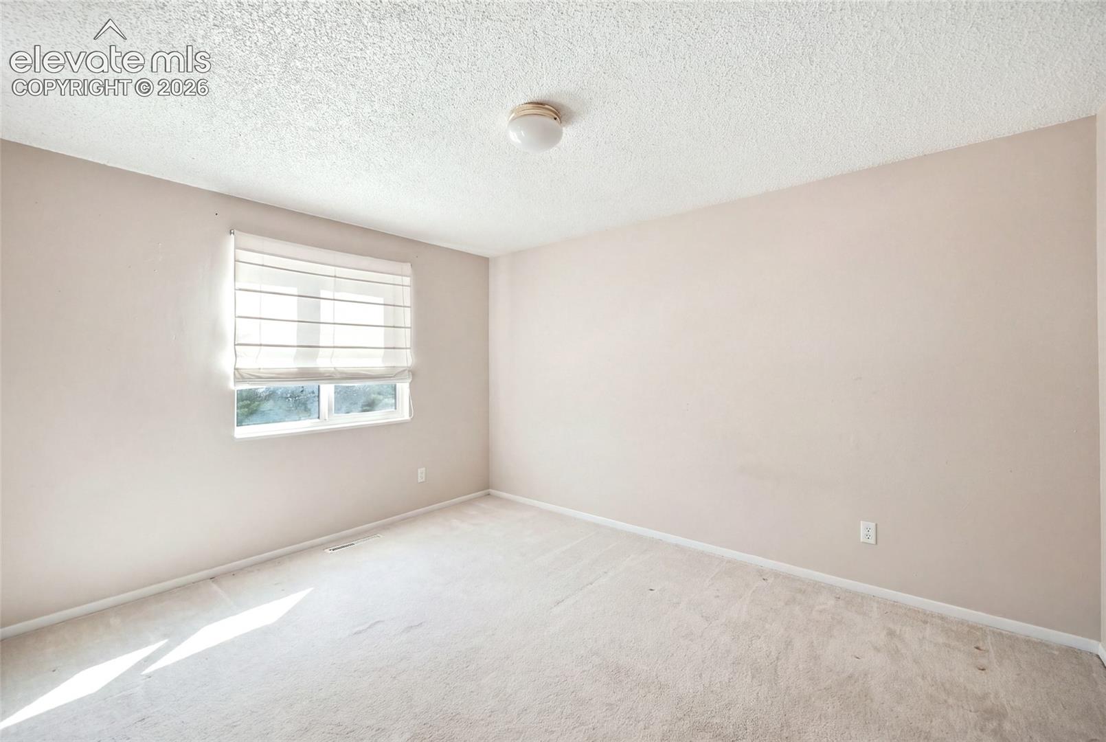 Upper level bedroom.  AI removed items from picture.  Room shown here may not be representative of current condition