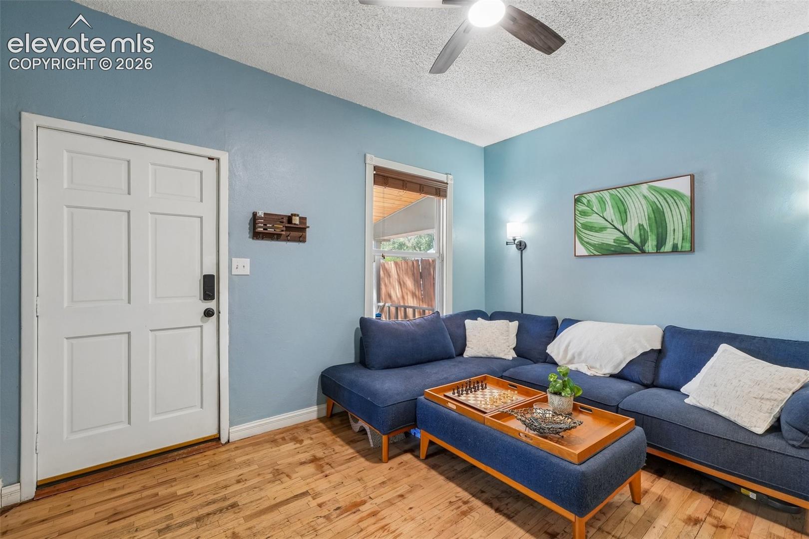Spacious living room with wood flooring
